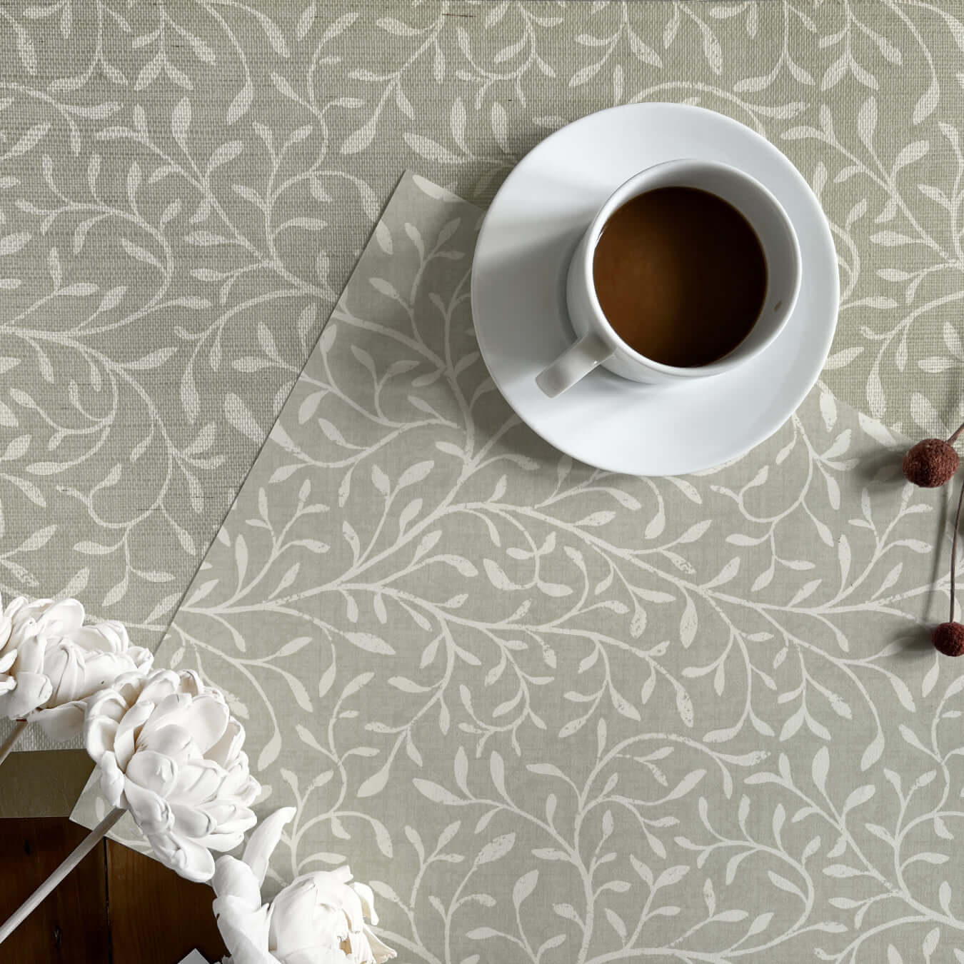 two pre pasted wallpaper samples with a botanical print pattern