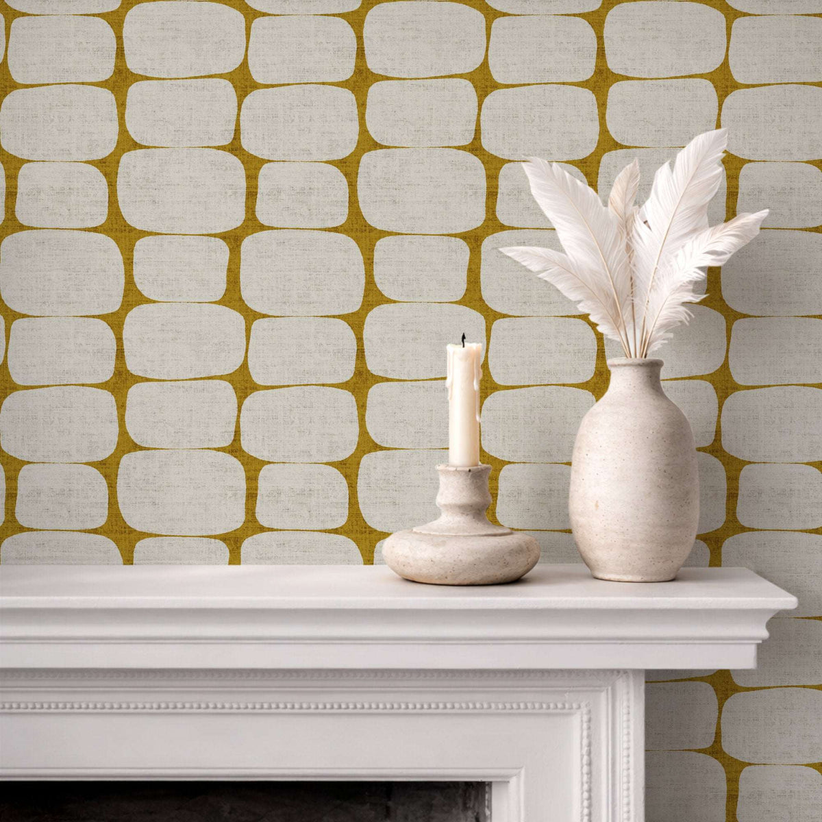Wall with mustard yellow geometric pebble wallpaper stripe pattern of rounded rectangles on light base.