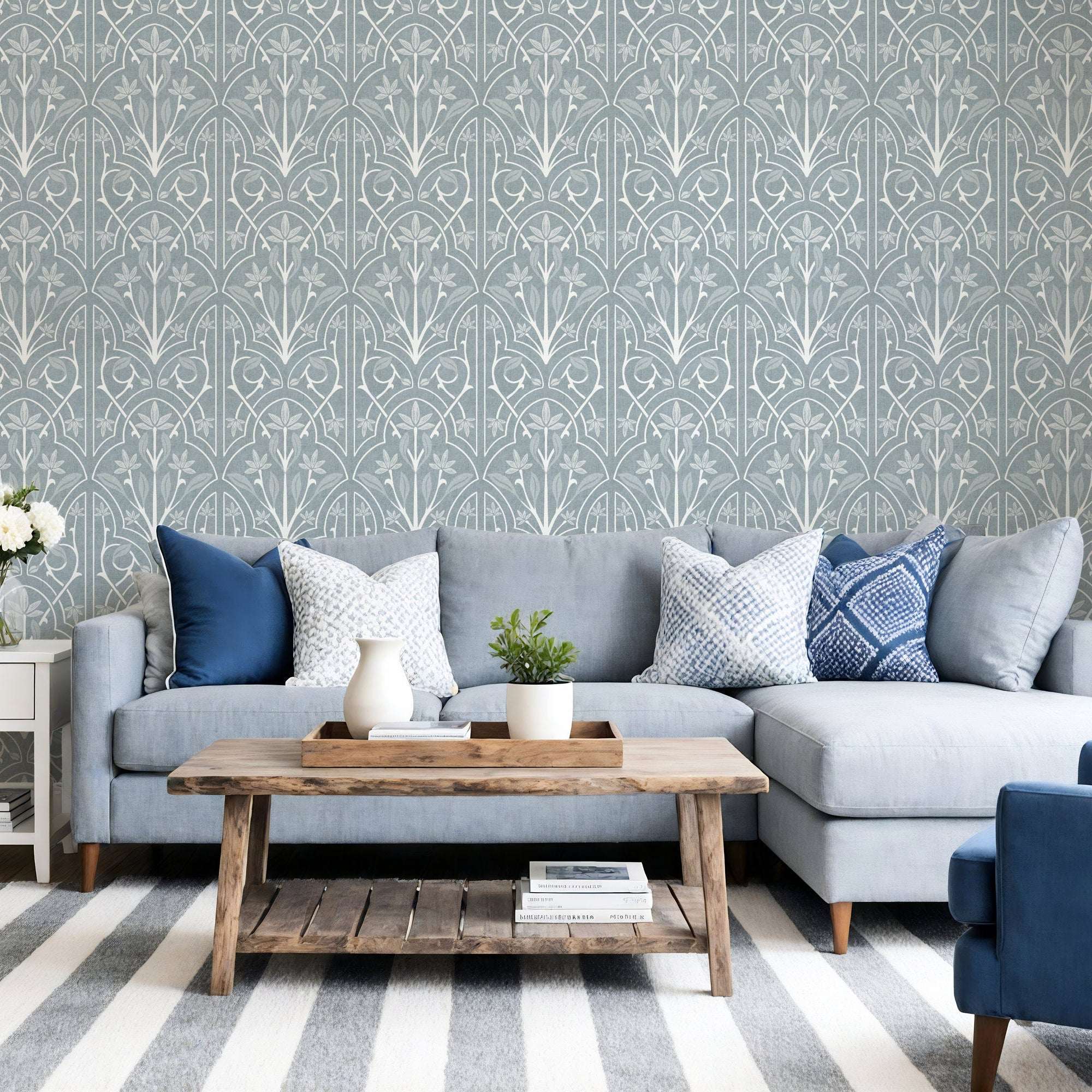 Blue-gray floral trellis wallpaper with repeating art nouveau leaf and vine motifs