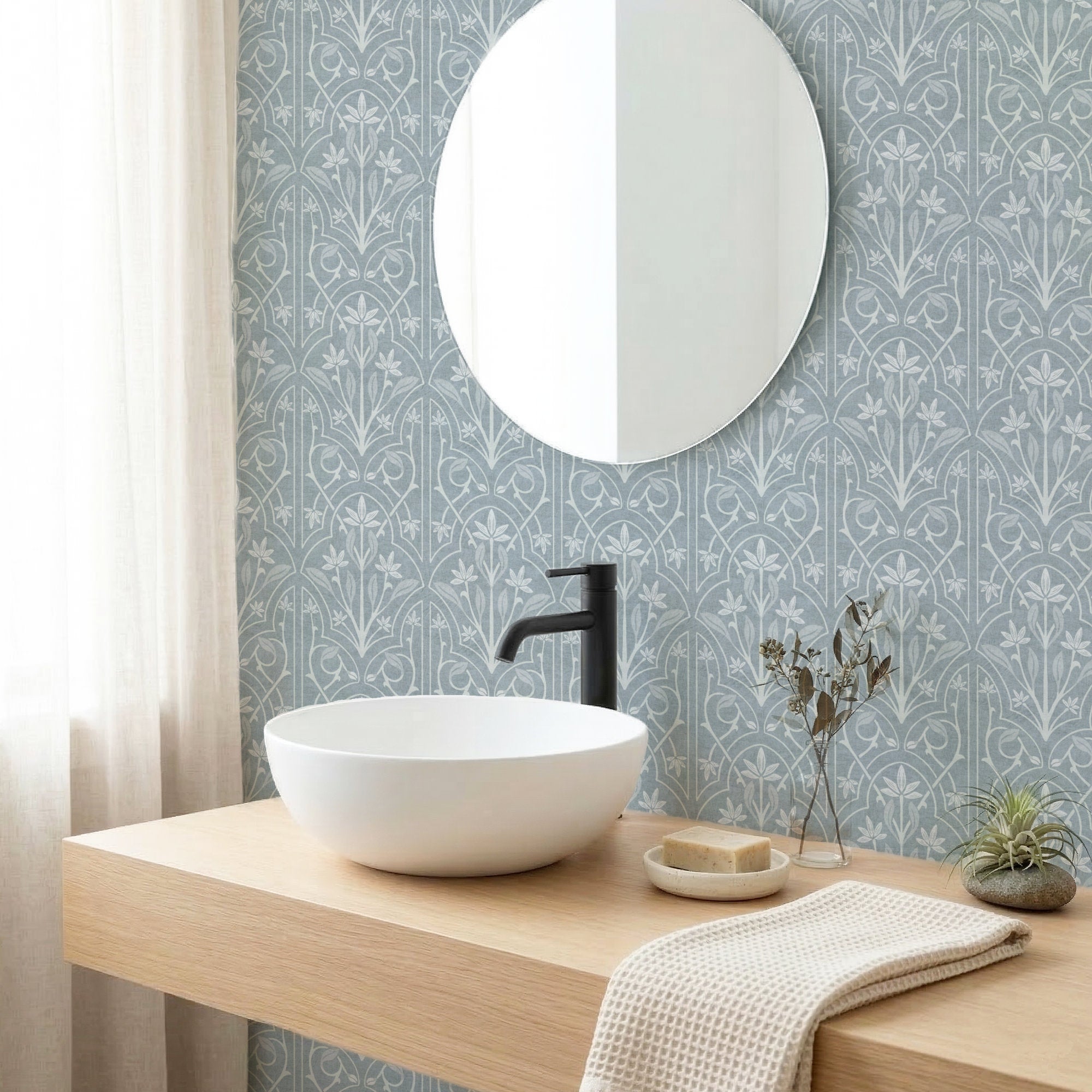 Blue and White Art Nouveau Trellis Wallpaper in a Bathroom setting with basin sink and round mirror