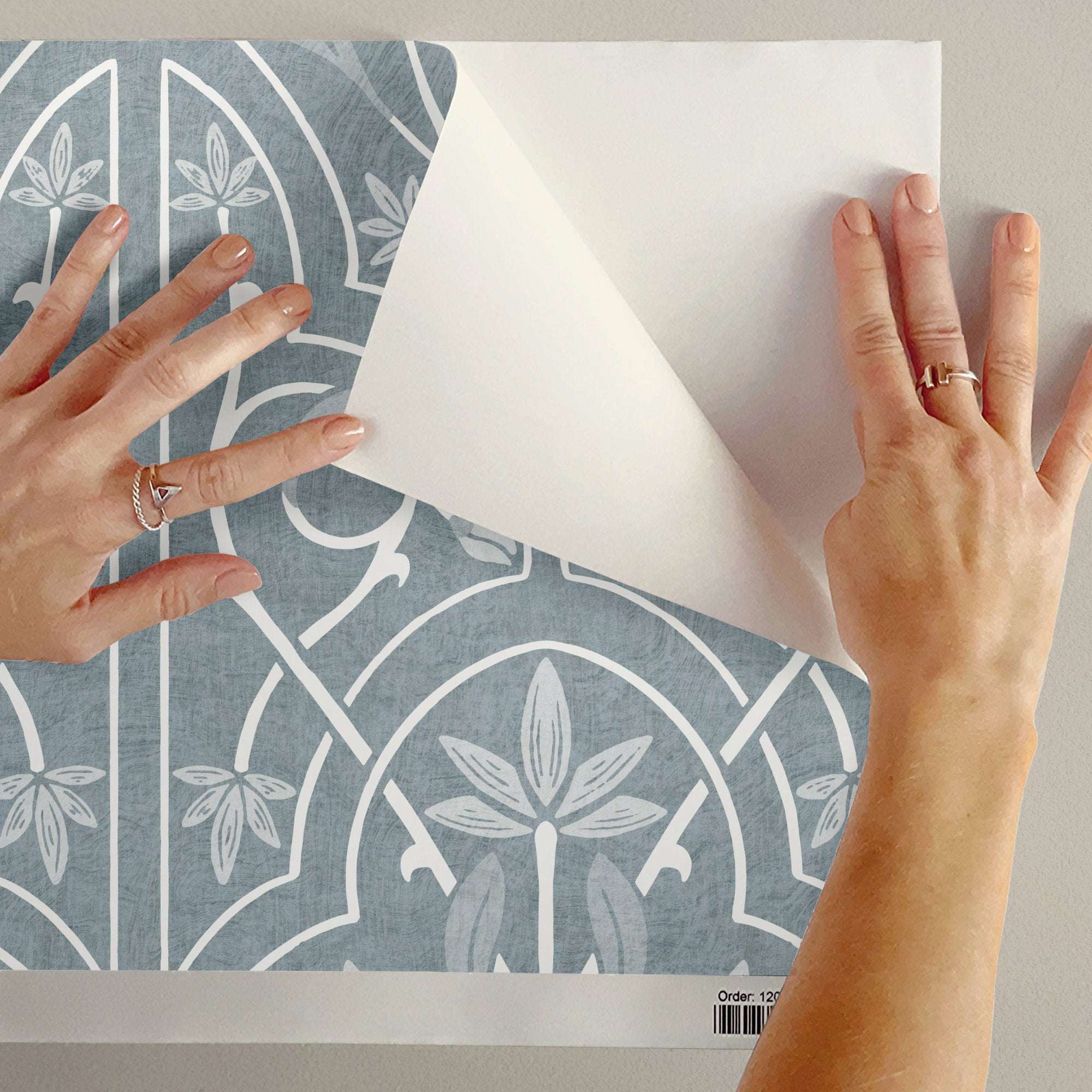 Blue floral trellis wallpaper sheet with white leaf fan and vine trellis pattern