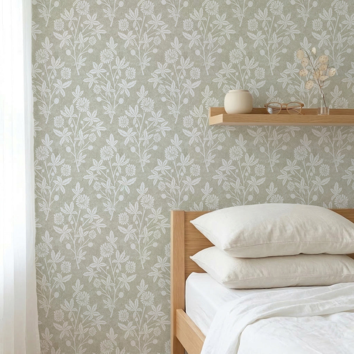 Bedroom with green Block Printed floral wallpaper in a geometric diamond and wooden shelf