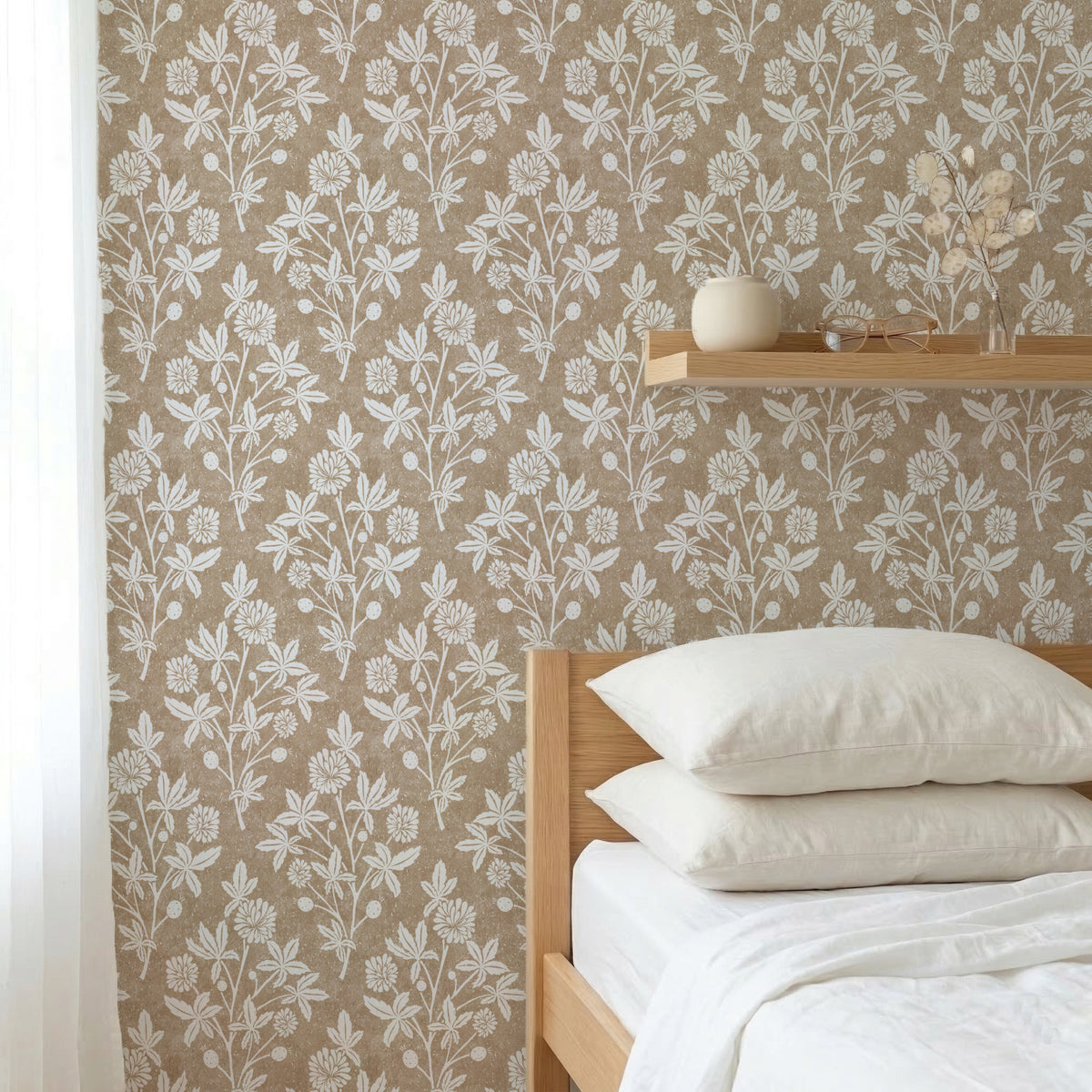 Bedroom with tan brown block print floral wallpaper in a geometric diamond and wooden bed