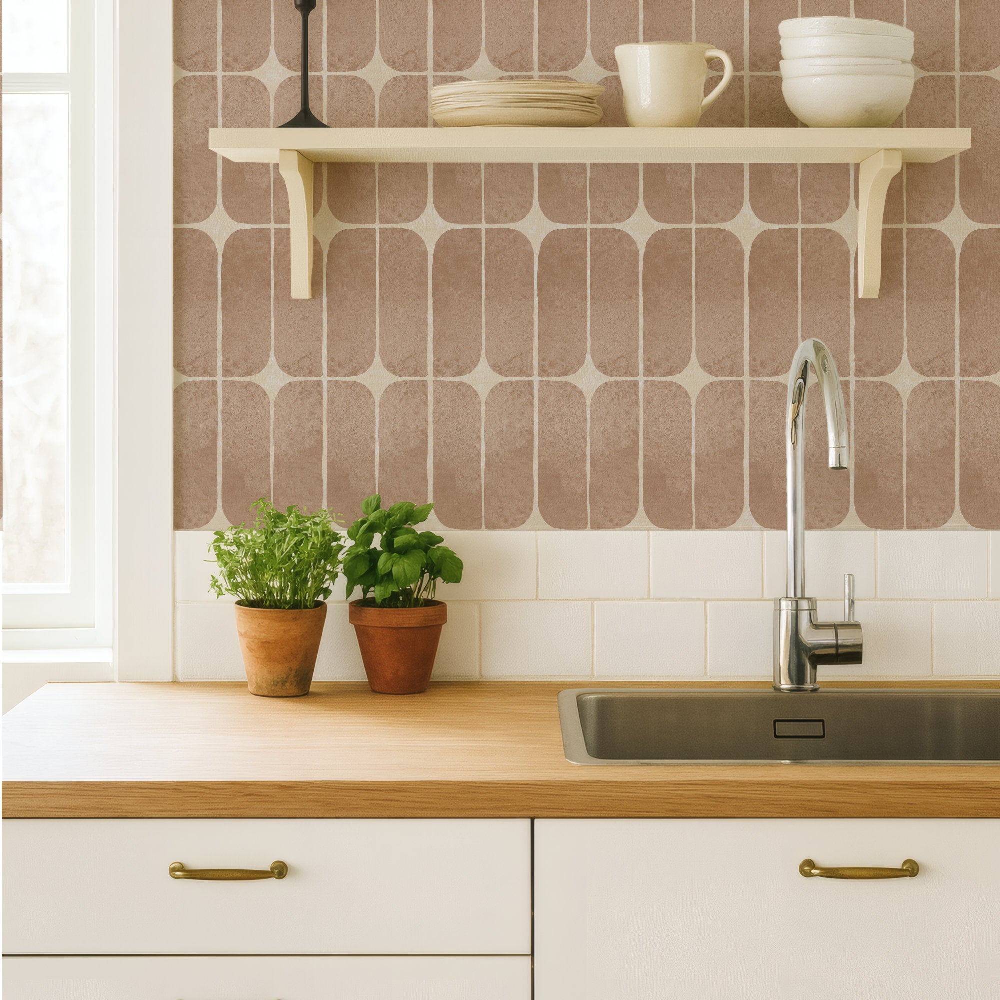 Pink retro tile wallpaper as a kitchen backsplash behind a sink