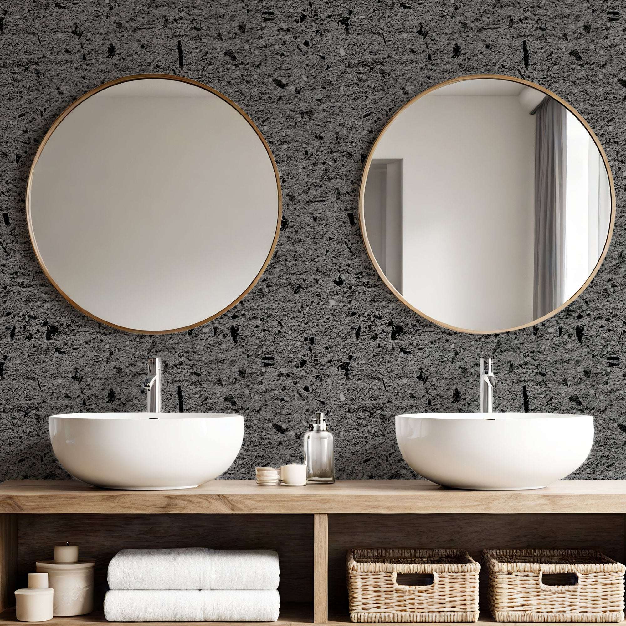 Concrete-effect wallpaper in dark grey with speckled aggregate texture on wall