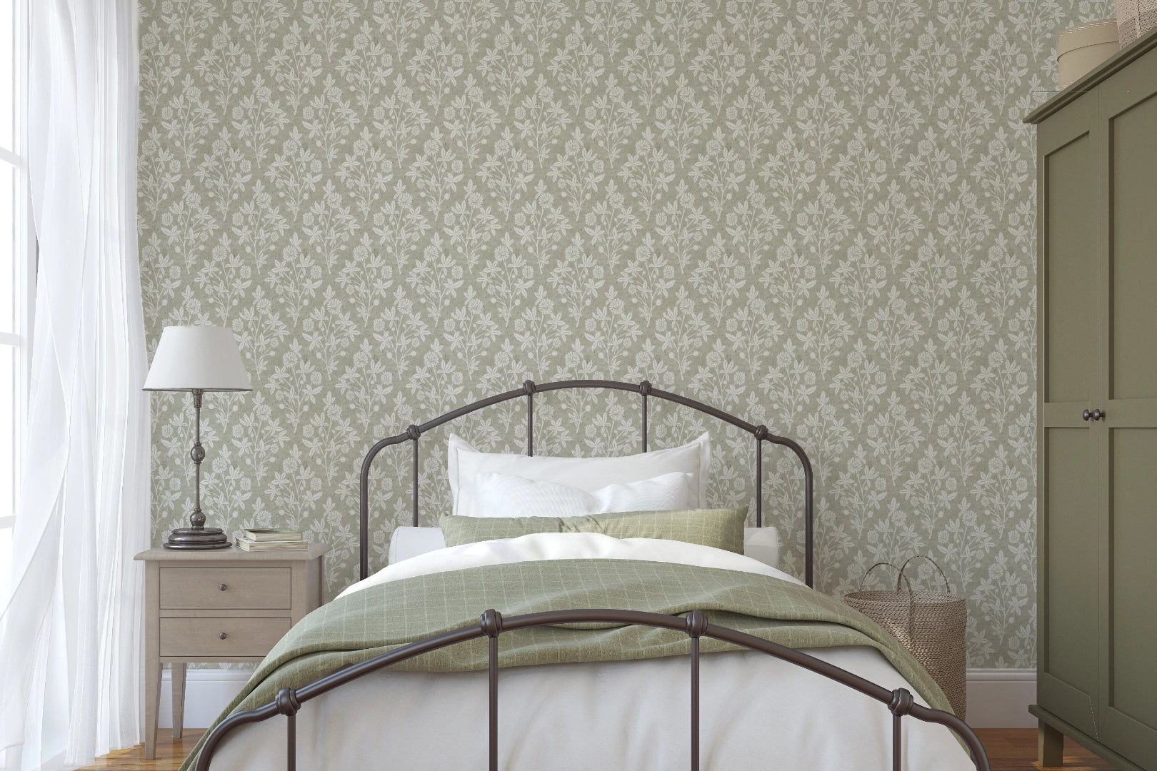 Bedroom with floral block print green patterned wallpaper, bed, nightstands, and wardrobe.