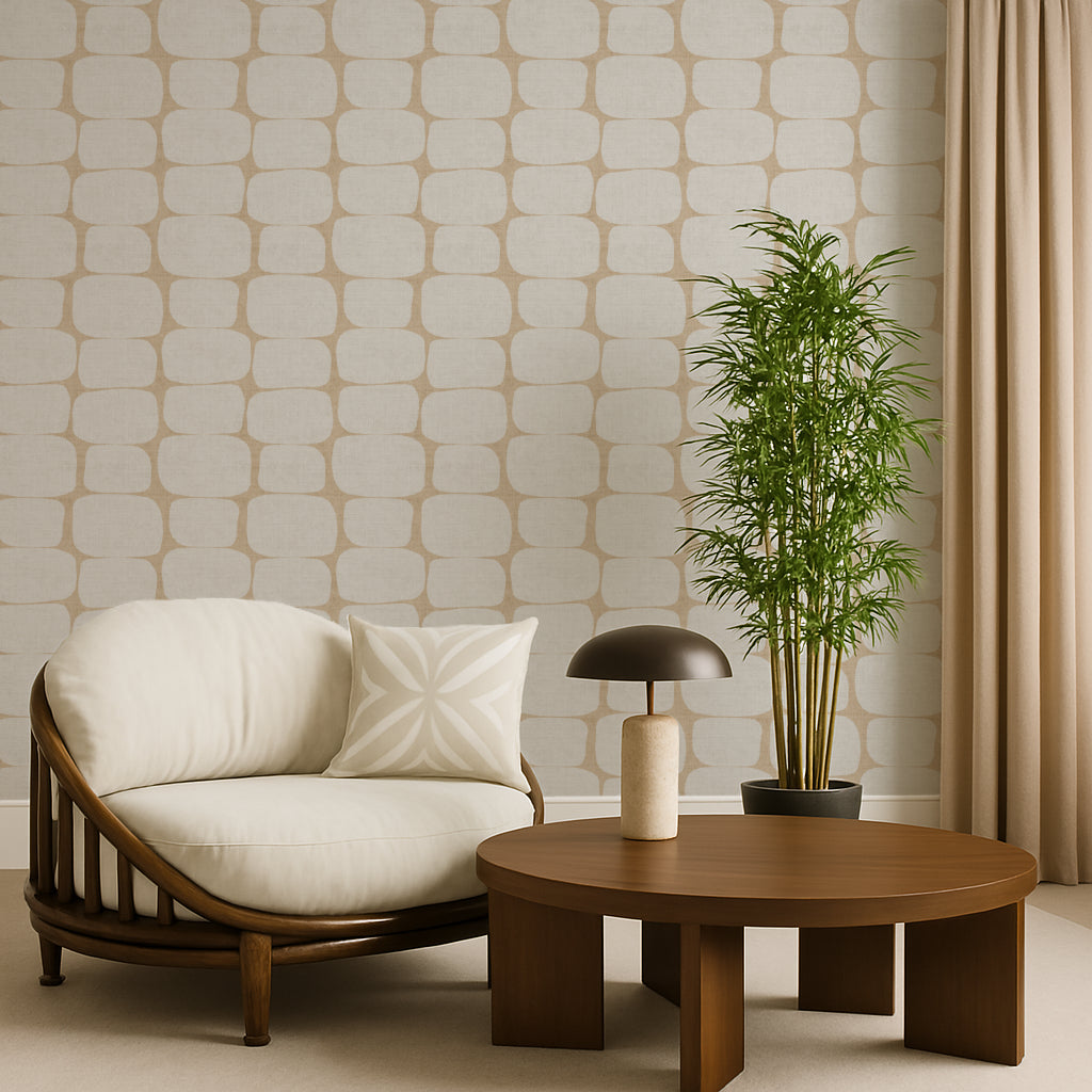 Modern geometric wallpaper in a living room with a white armchair, wooden coffee table, and potted plant against a patterned wall.