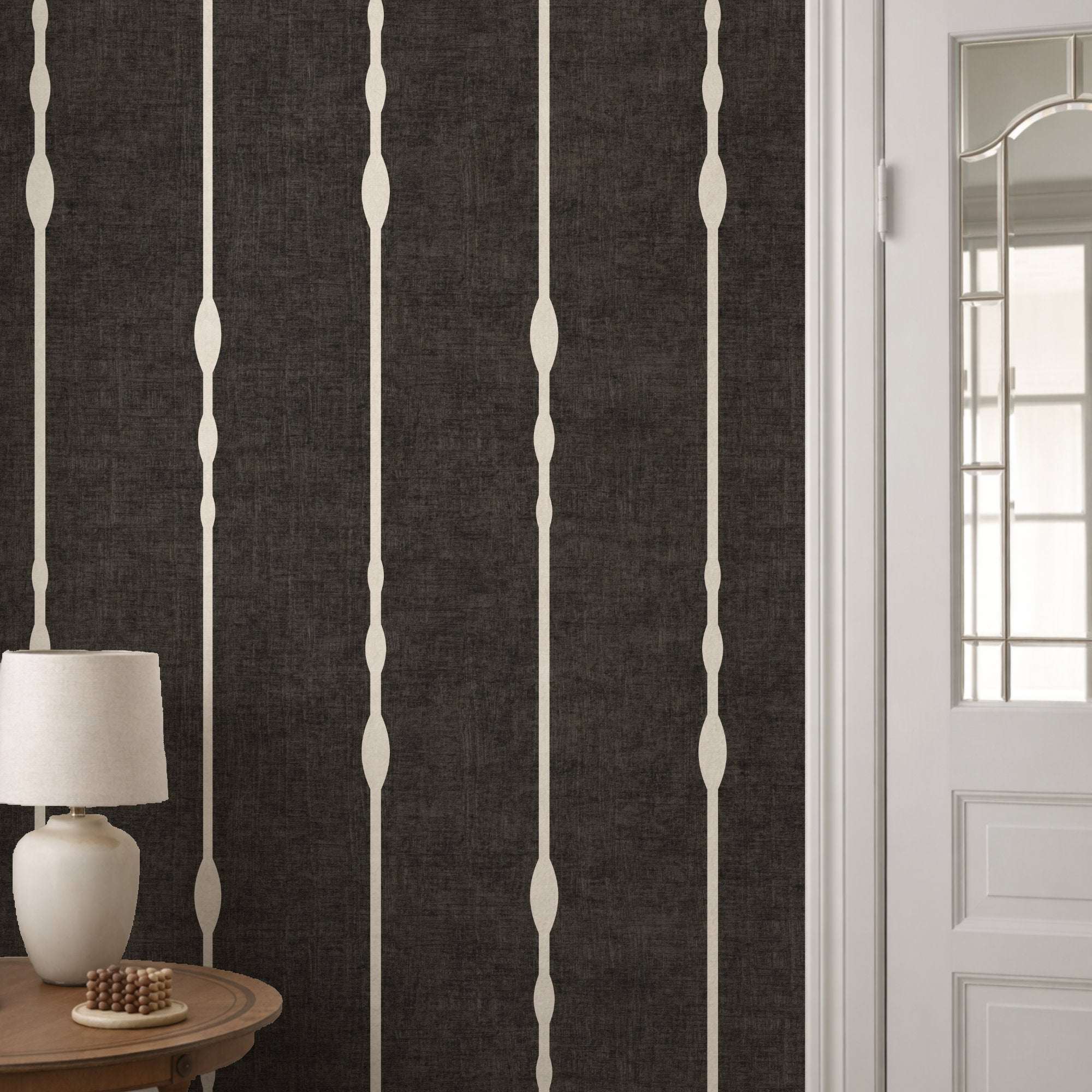 Vertical striped wallpaper with beaded pattern on dark gray/black ground and light stripes