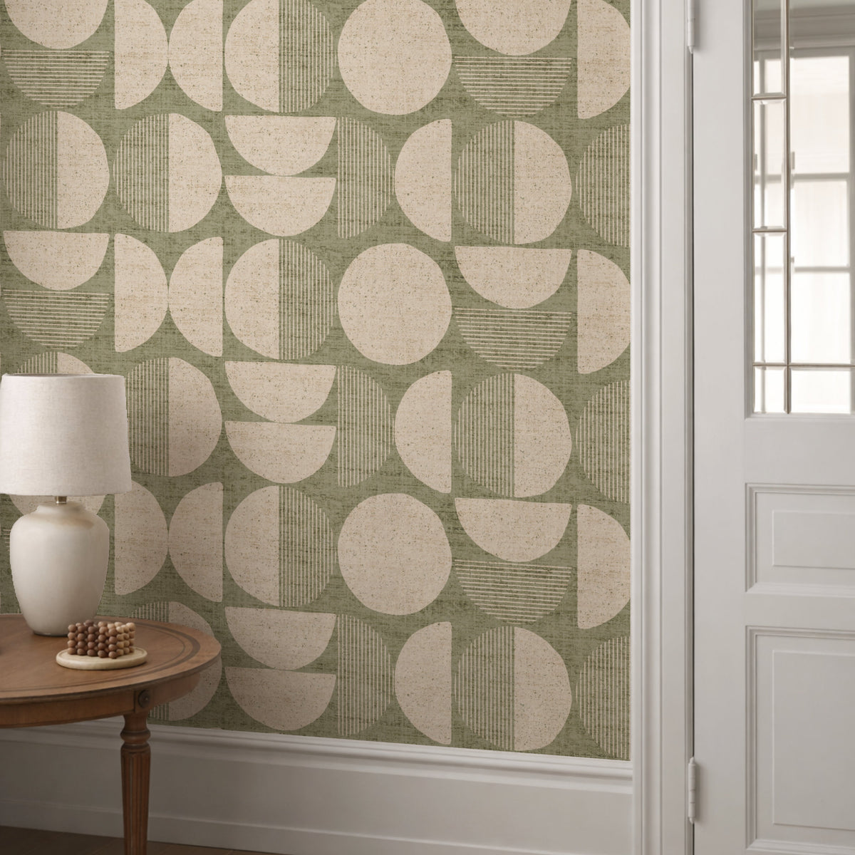 Sage green mid-century modern circle wallpaper in hallway with white panelling