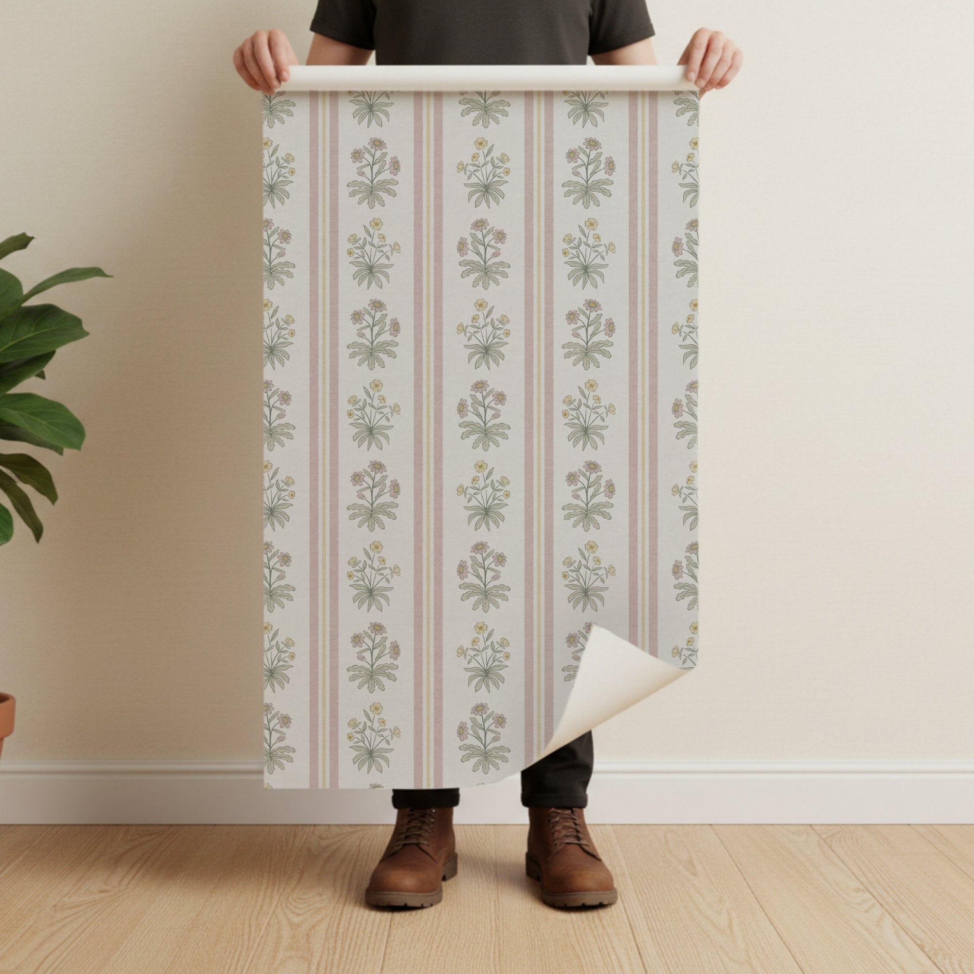 Floral stripe wallpaper with cottage flowers on pale background and vertical pink stripes, roll shown