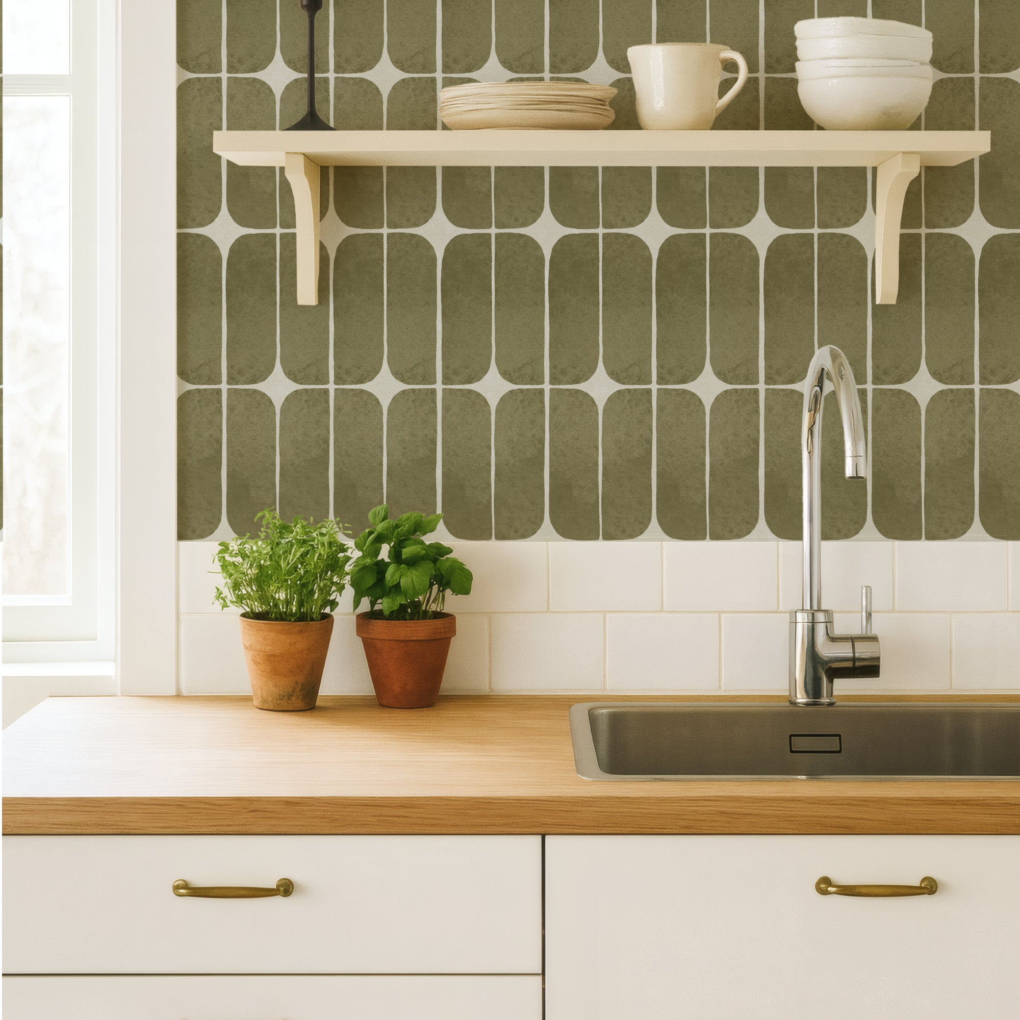 Olive green retro tile wallpaper as a kitchen backsplash behind a sink