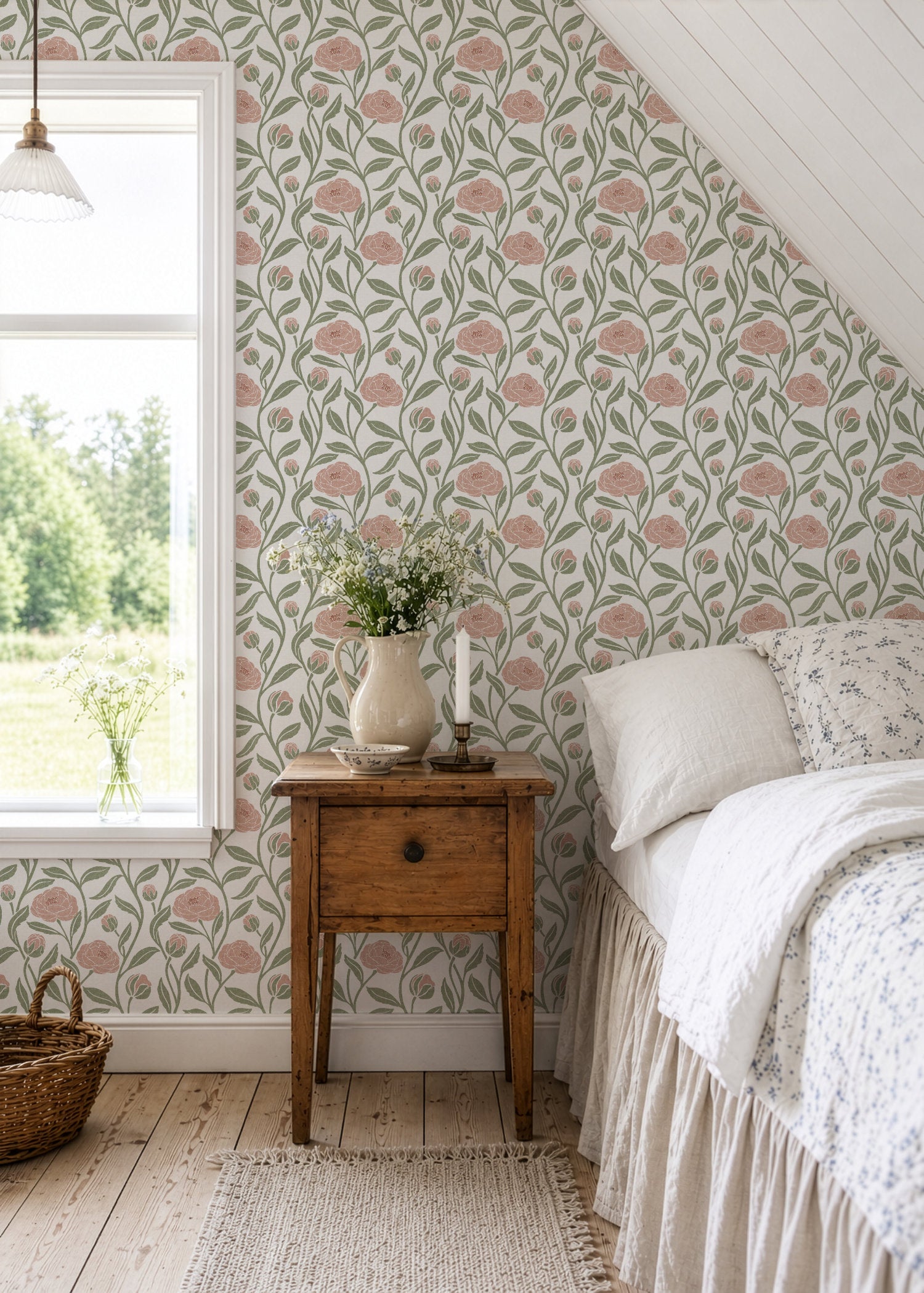 Blush pink peony flower wallpaper in a bedroom with a sloped ceiling and side table