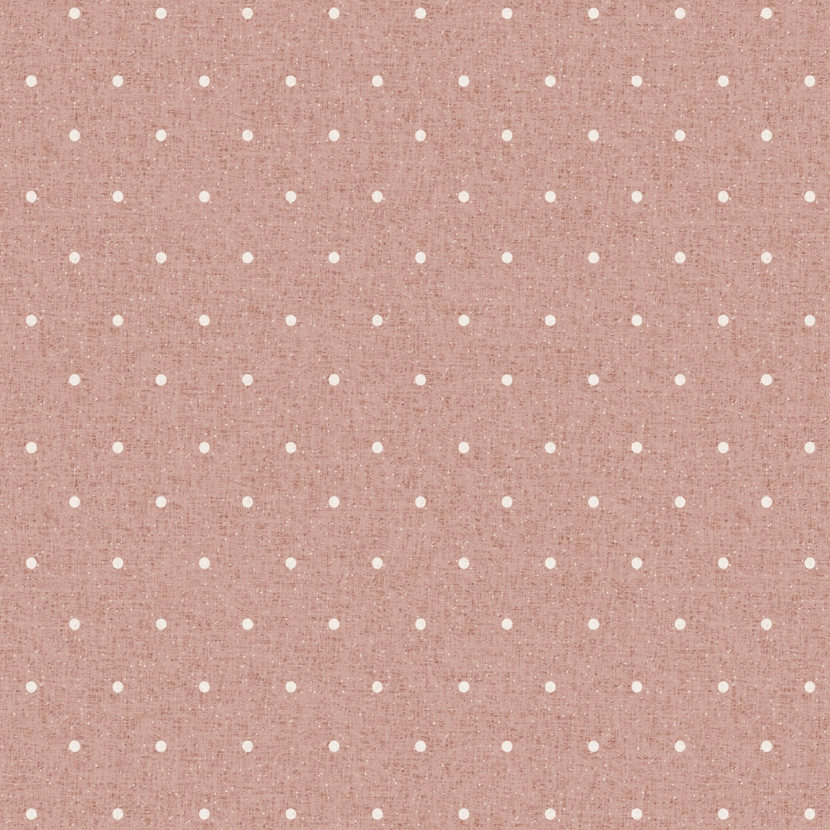 A close-up of dusty pink polka dot wallpaper, showing small cream dots set in an even grid across a softly textured, linen-like ground. The weave of the background and a fine flecking through the colour are visible at this distance.