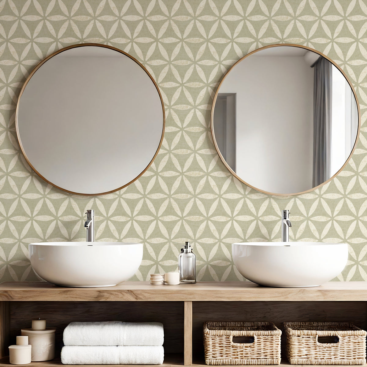 Light green geometric wallpaper in bathroom with double basins and round gold mirrors