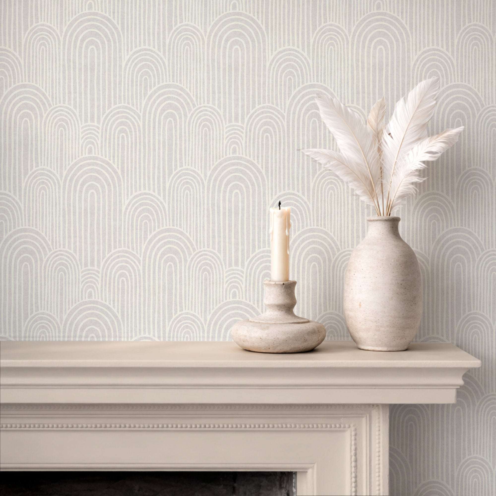 Arches wallpaper on a wall with repeating arch motif and vertical stripe accents in soft neutrals.