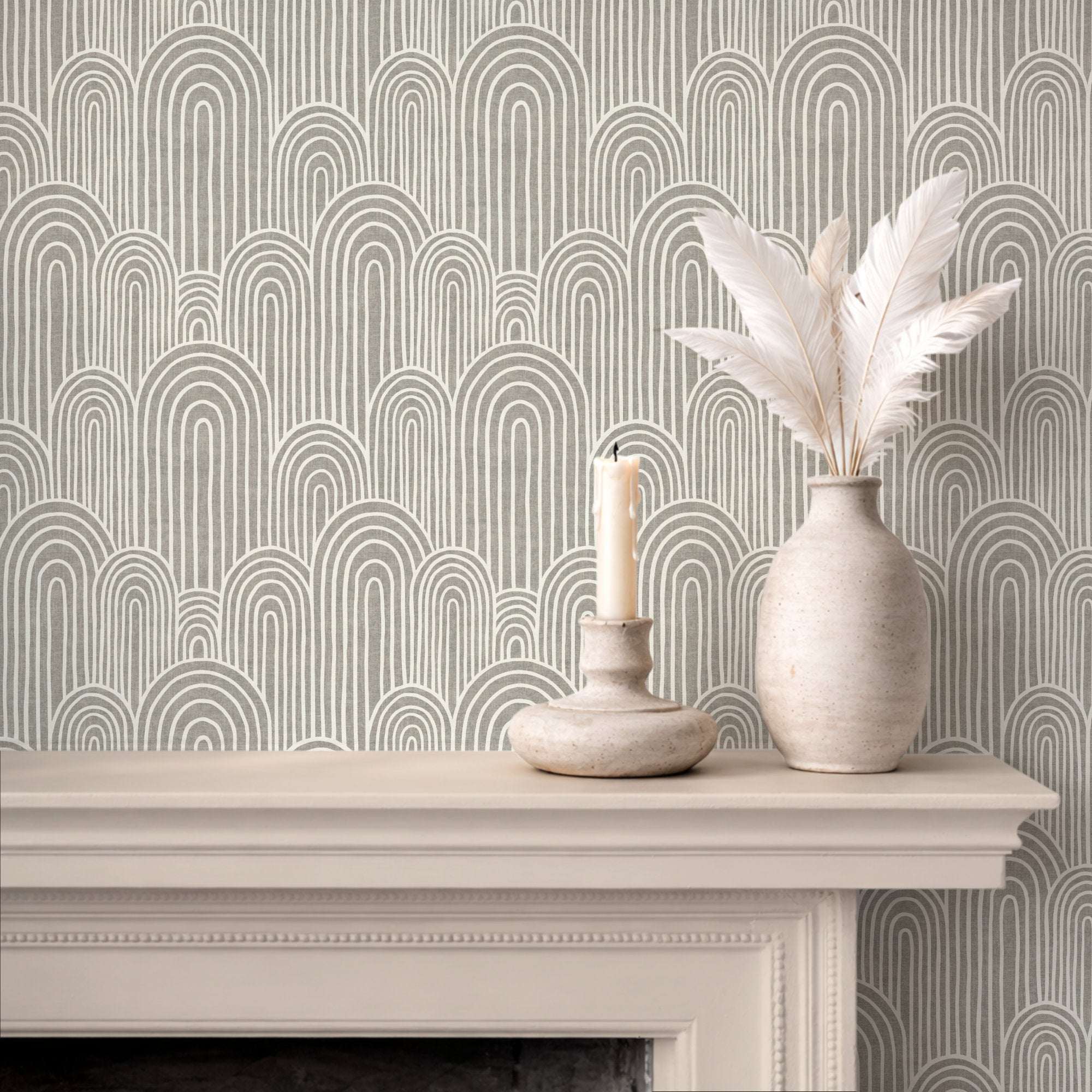 Arches wallpaper pattern on a wall, featuring repeated arch outlines in muted green and cream.