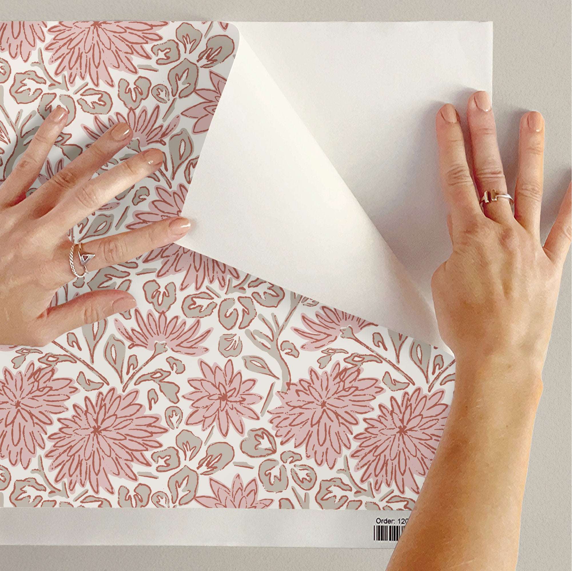Pink sketchy floral wallpaper with hand-drawn dahlias and leaves on white backing