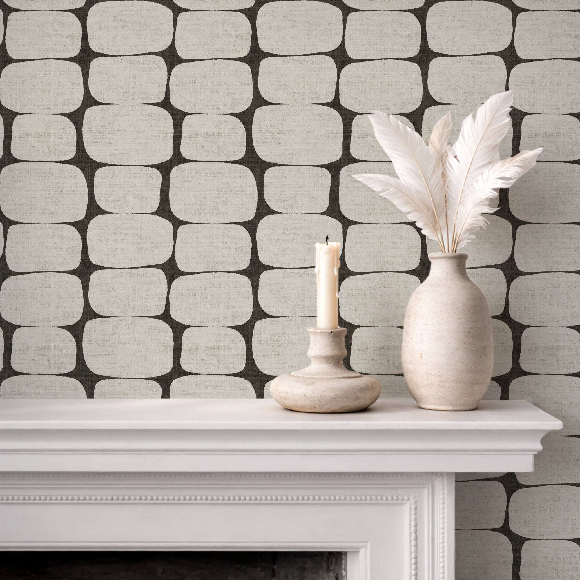 Wallpaper with dark gray geometric pebble stripe pattern of rounded rectangles on light base.