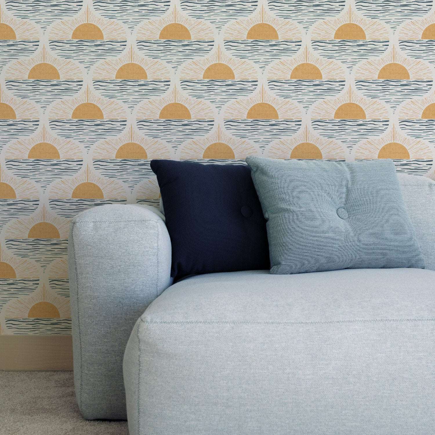 Sun and sea wallpaper behind sofa: cream with blue wave stripes and golden sunrise circles