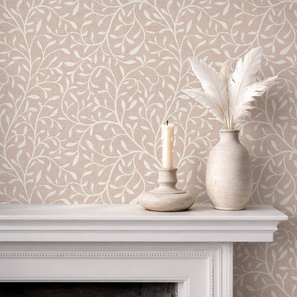 Botanical leaf silhouette wallpaper in dusty light pink on fireplace mantel with white vases