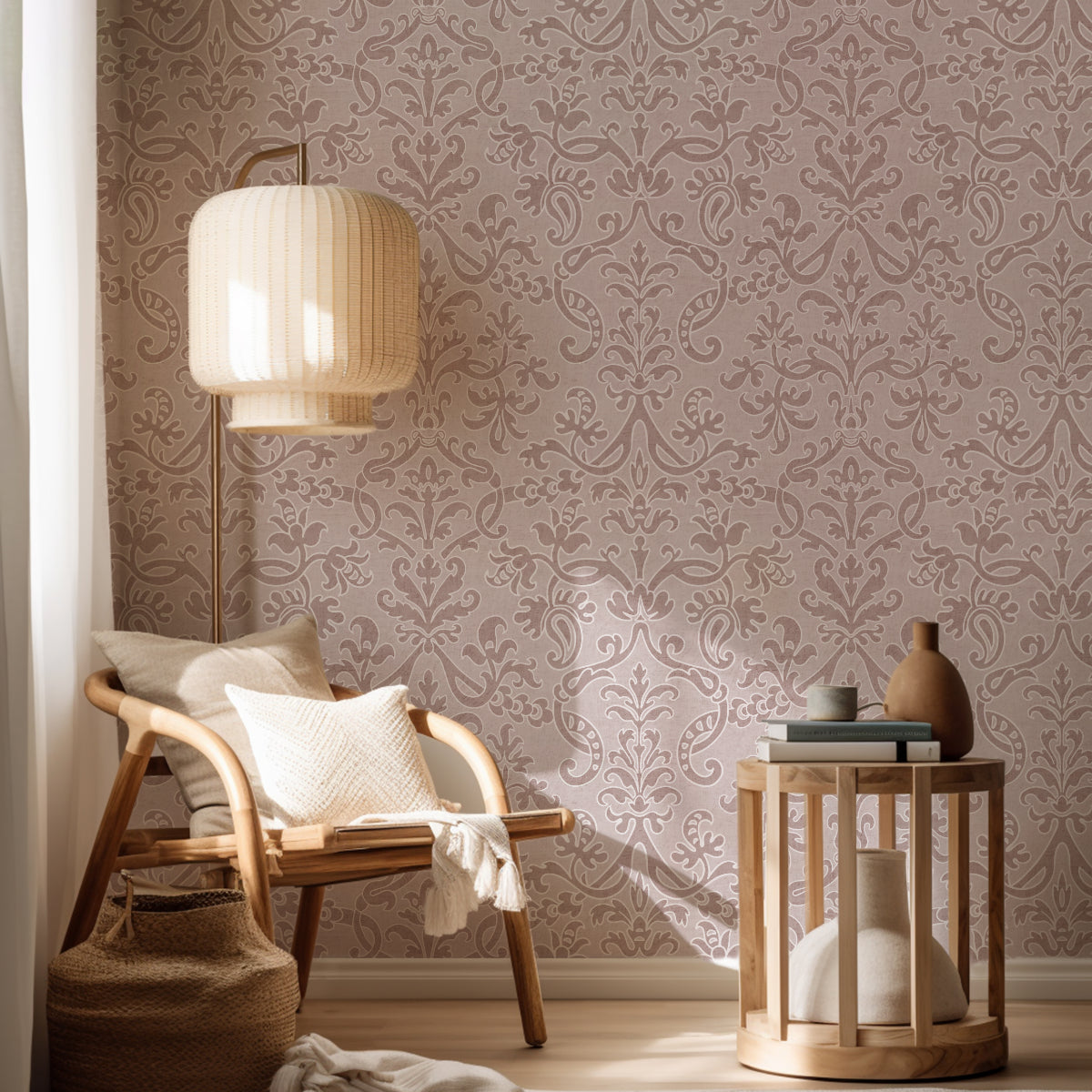 Minimalist reading corner with dusty pink Victorian damask wallpaper, beige armchair, and modern lamp.