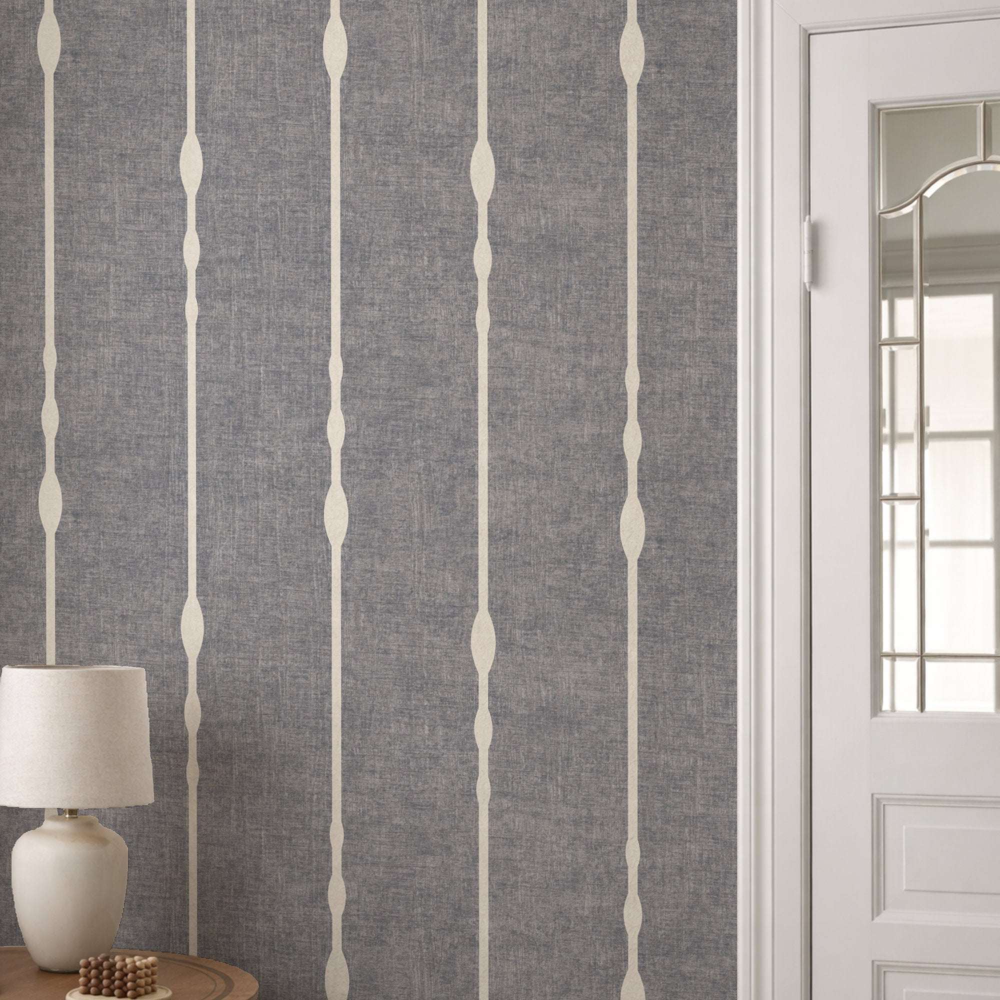 Vertical striped wallpaper with beaded stripe motif on medium gray ground and light vertical lines