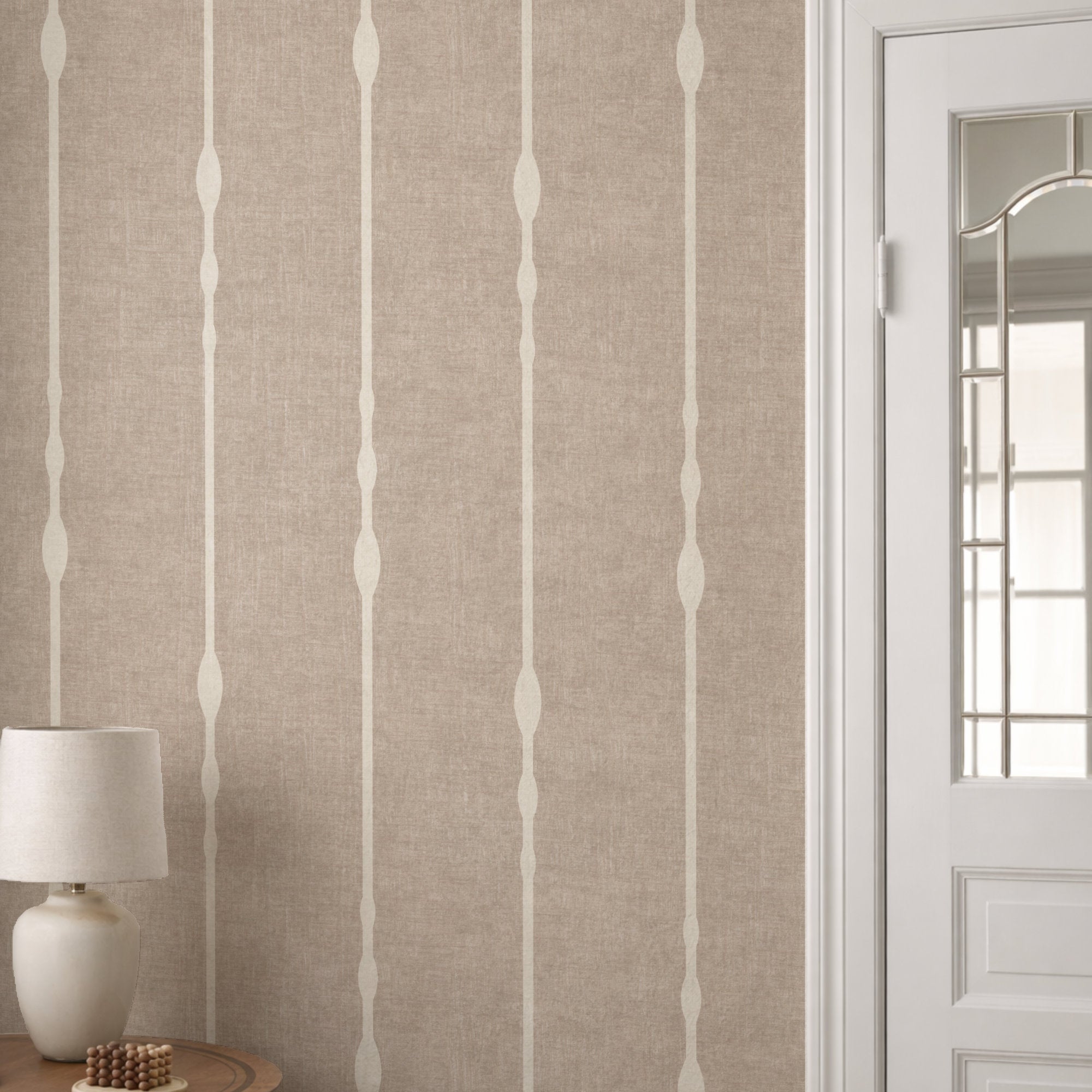 Vertical striped wallpaper in Warm Beige in neutral room with white panelling