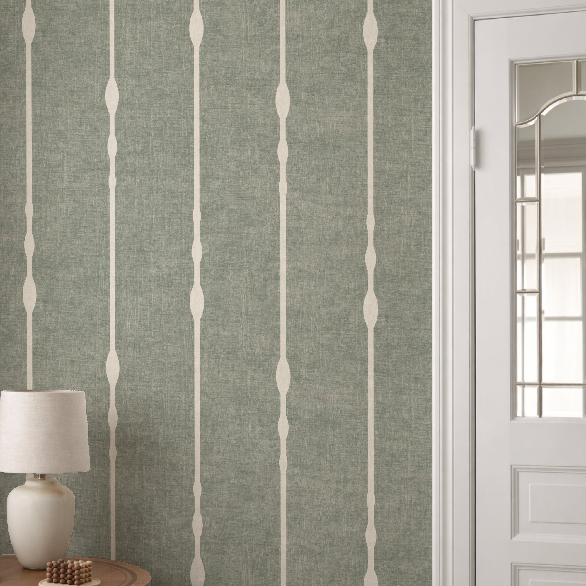 Vertical beaded stripe wallpaper in Sage Green as feature wall with white panelling