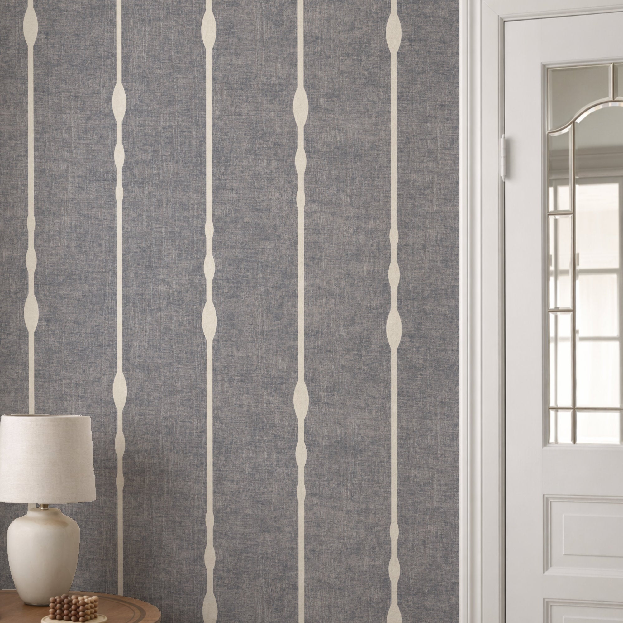 Vertical striped wallpaper in steel Blue as feature wall with white panelling