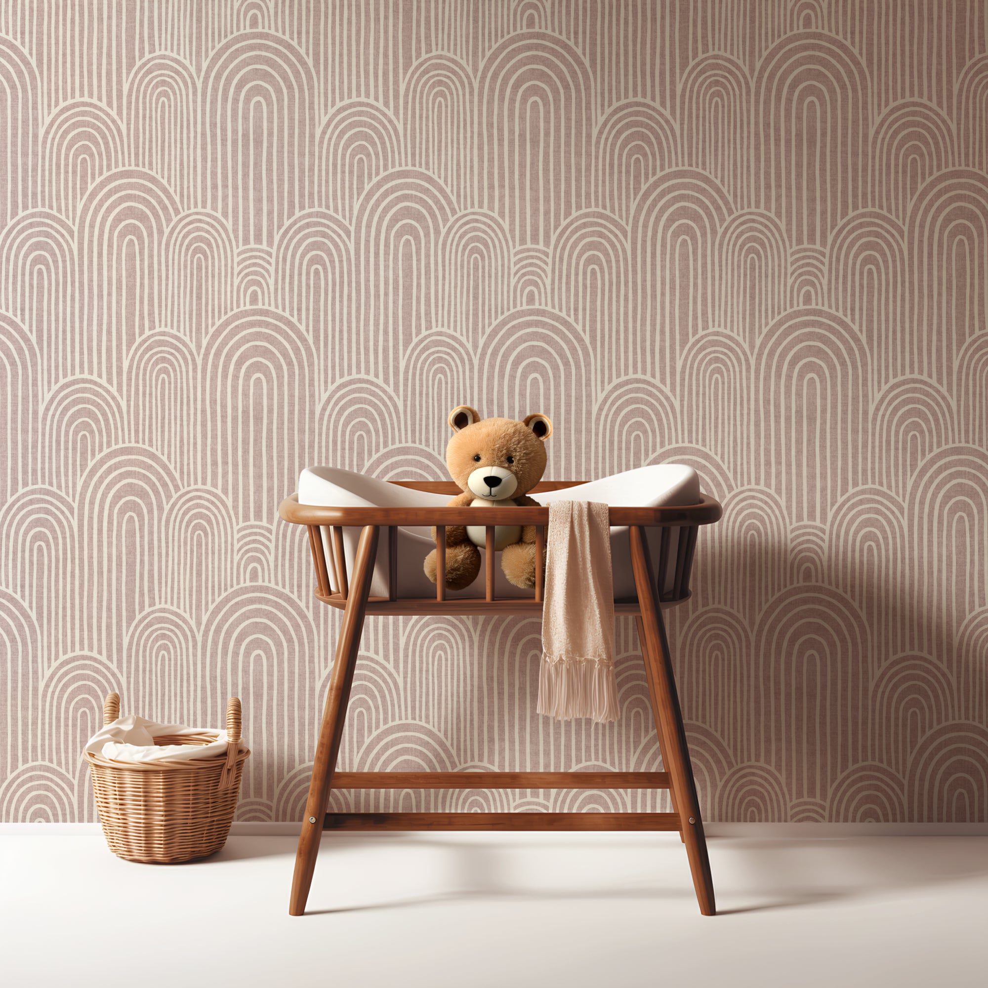 Pink Scandinavian arches wallpaper in a nursery with a wooden bench and teddy bear