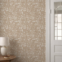 Brushstroke wallpaper roll in caramel tan abstract pattern styled in a hallway