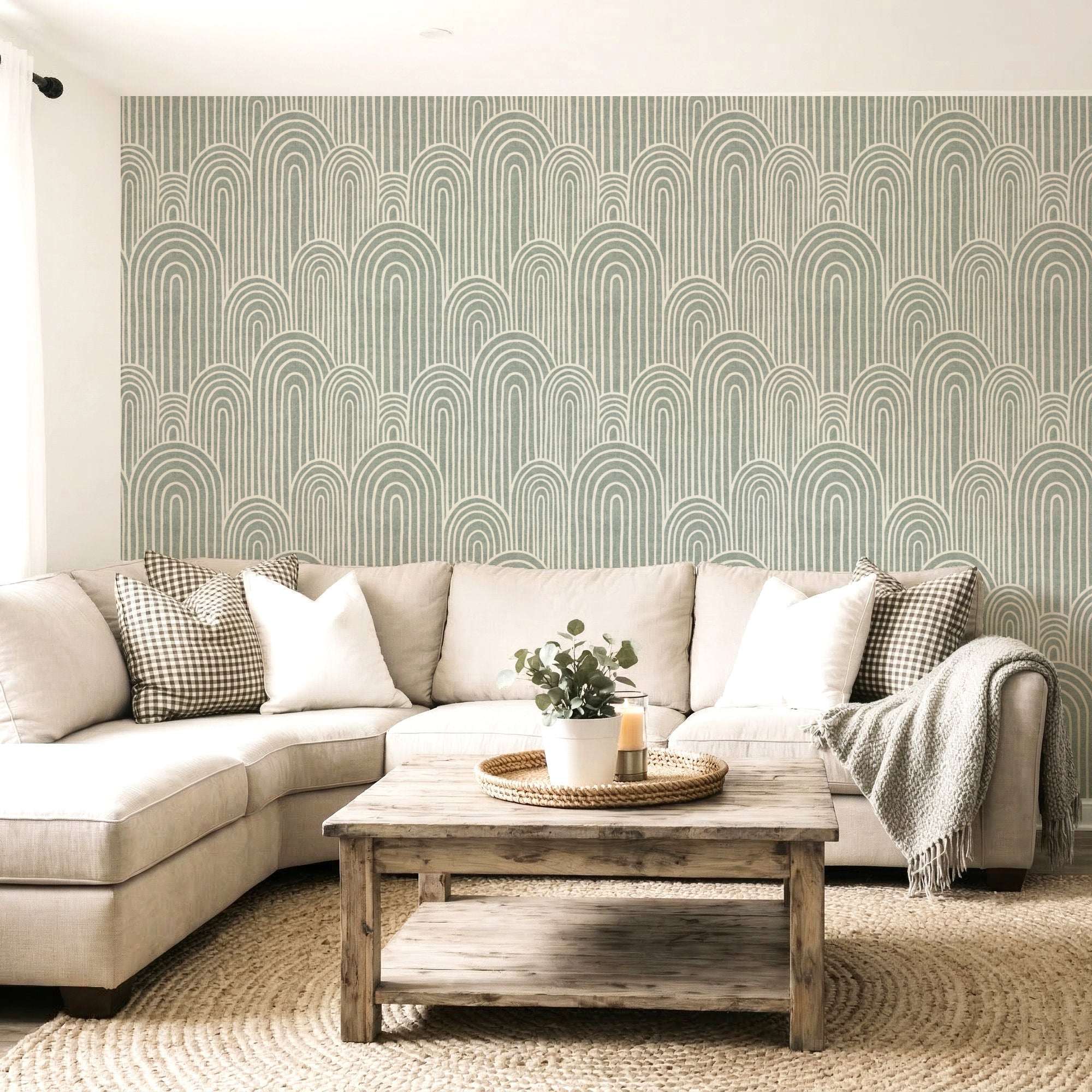 Arches wallpaper on a living room wall with repeating arch and vertical stripe design in soft green.