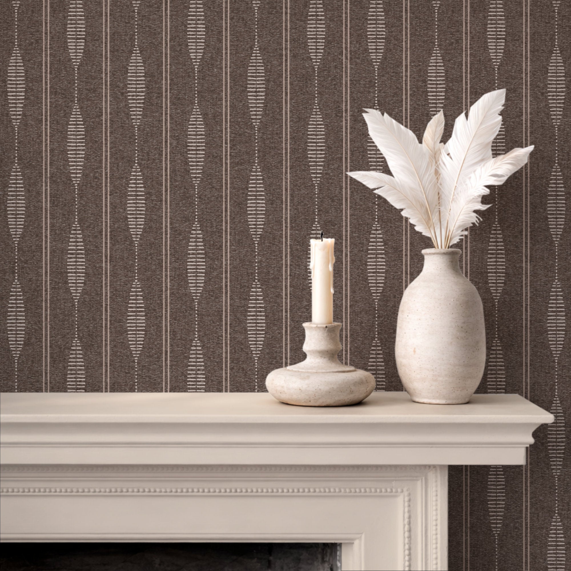 Brown linen stripe wallpaper behind a fireplace mantel with a candle and feathers