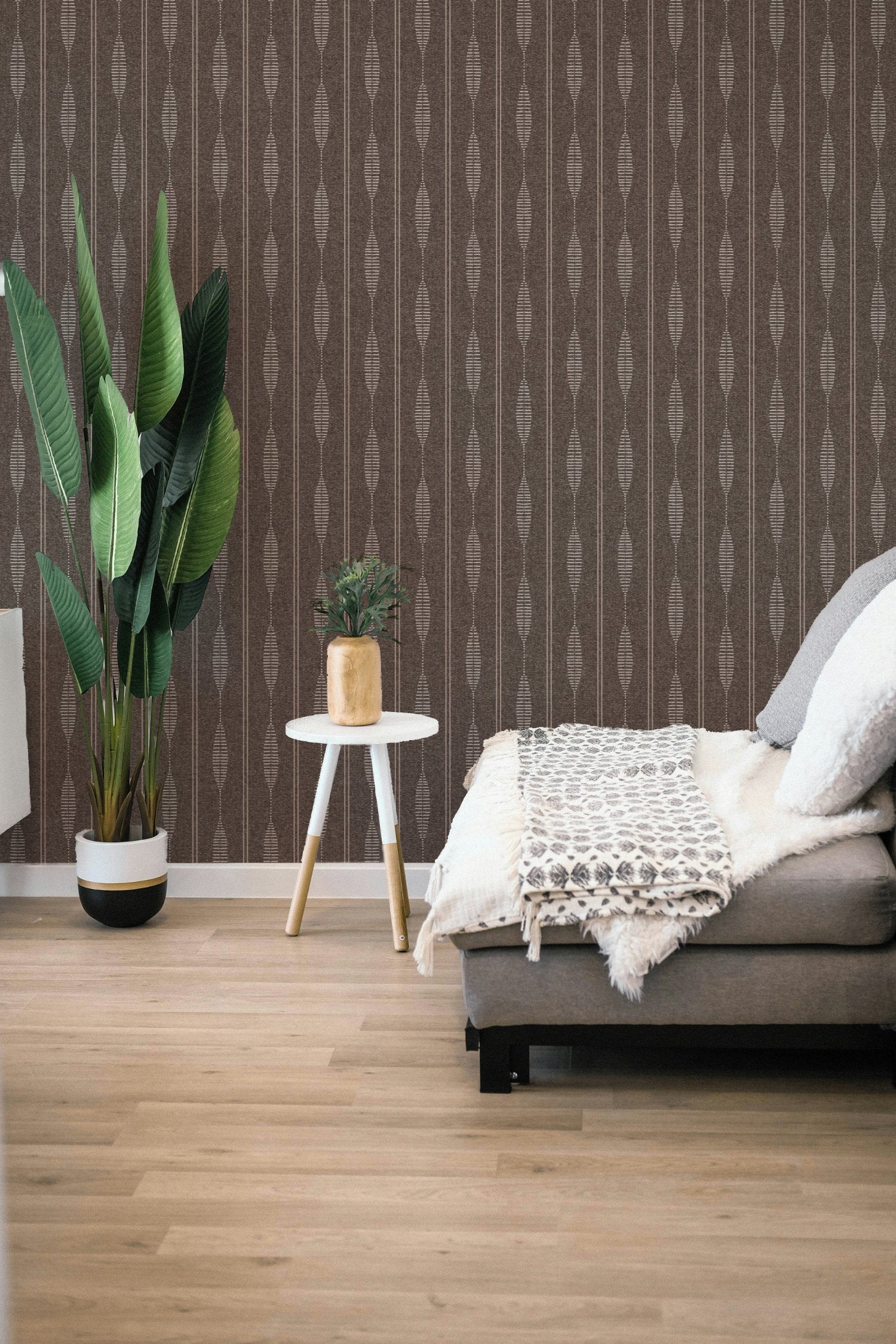 Brown linen stripe wallpaper in a boho bedroom, hand-drawn folk stripe with dashed lozenges