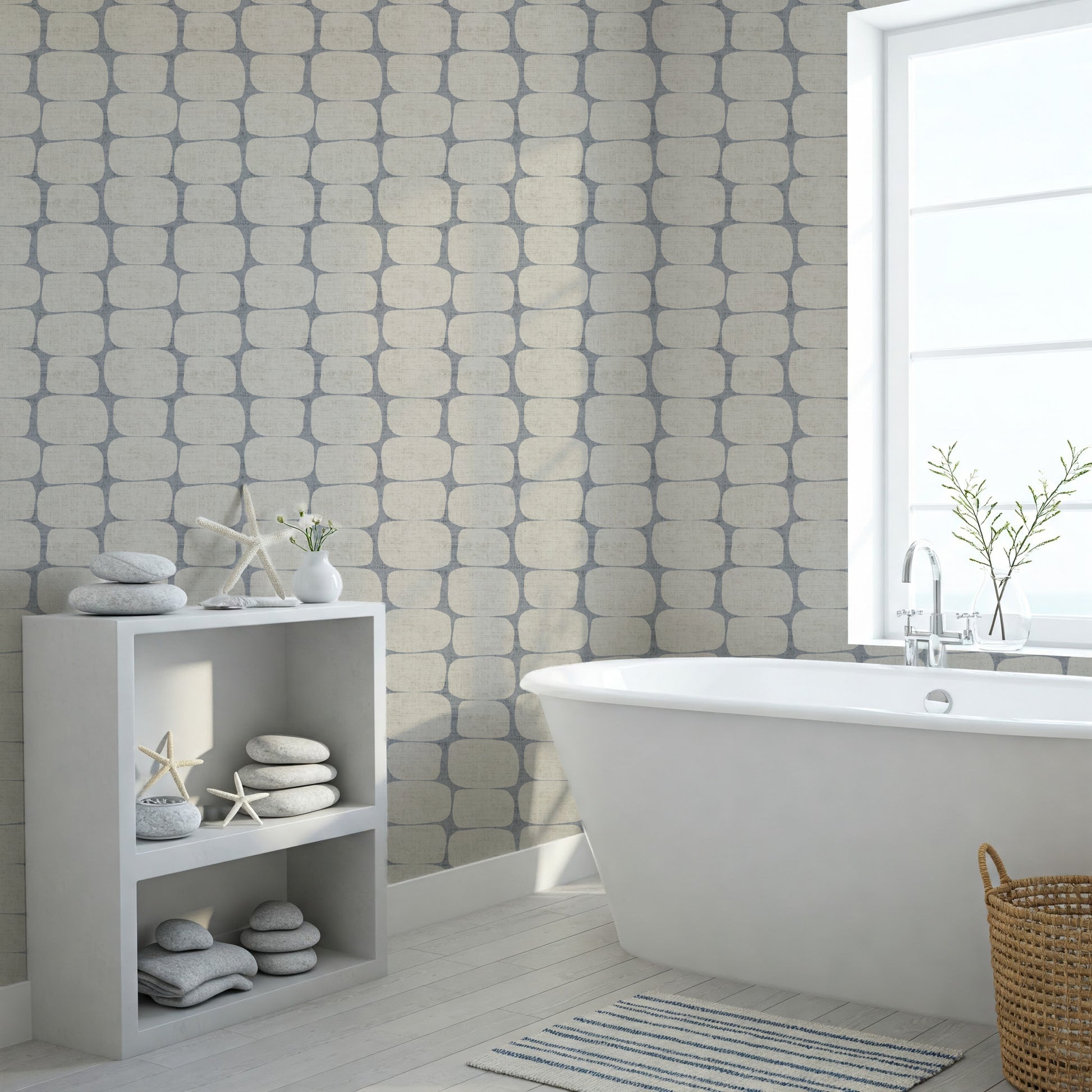 Modern bathroom with freestanding bathtub, geometric wallpapered wall, and decorative elements.