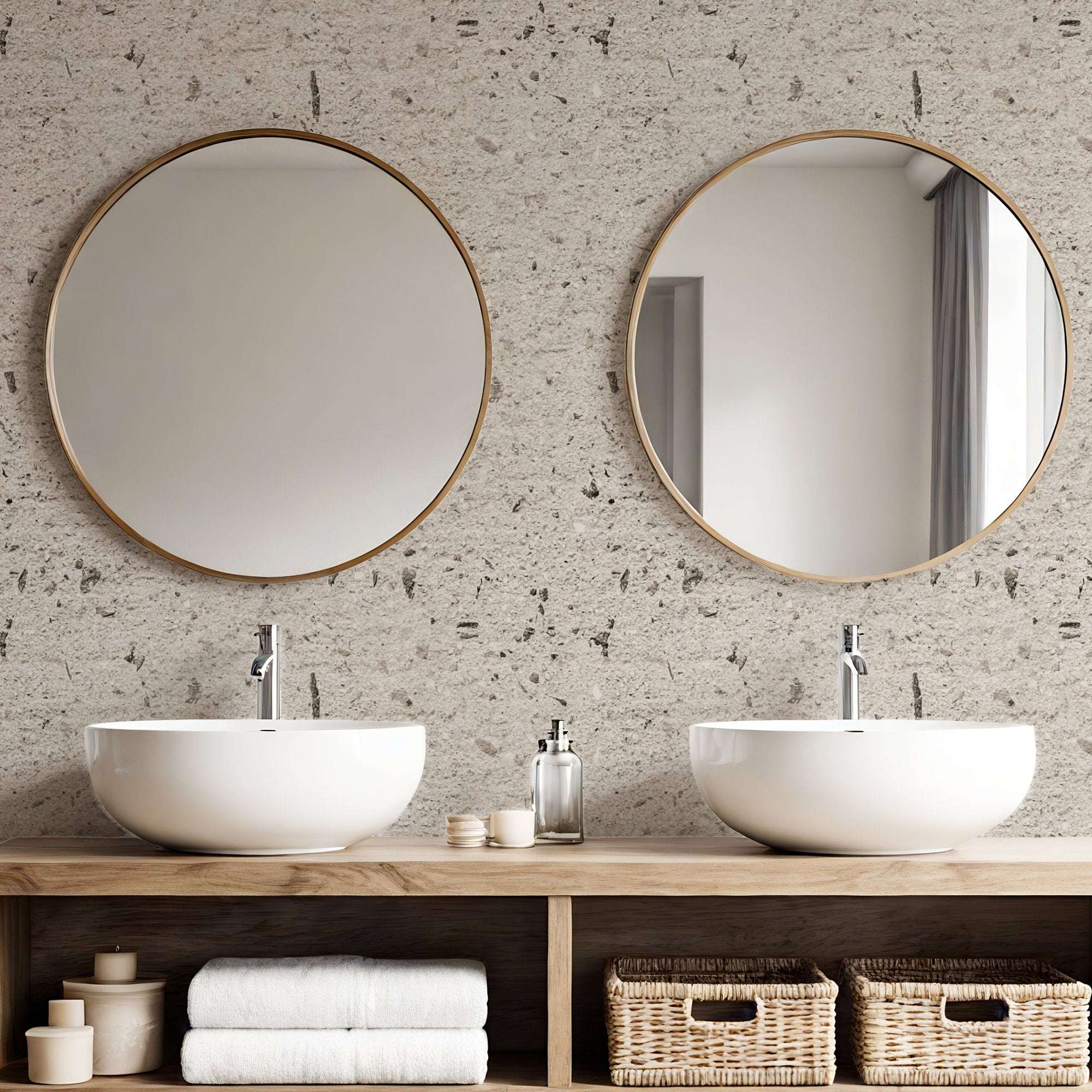 Concrete effect wallpaper in soft beige in bathroom with round mirrors and wooden vanity unit