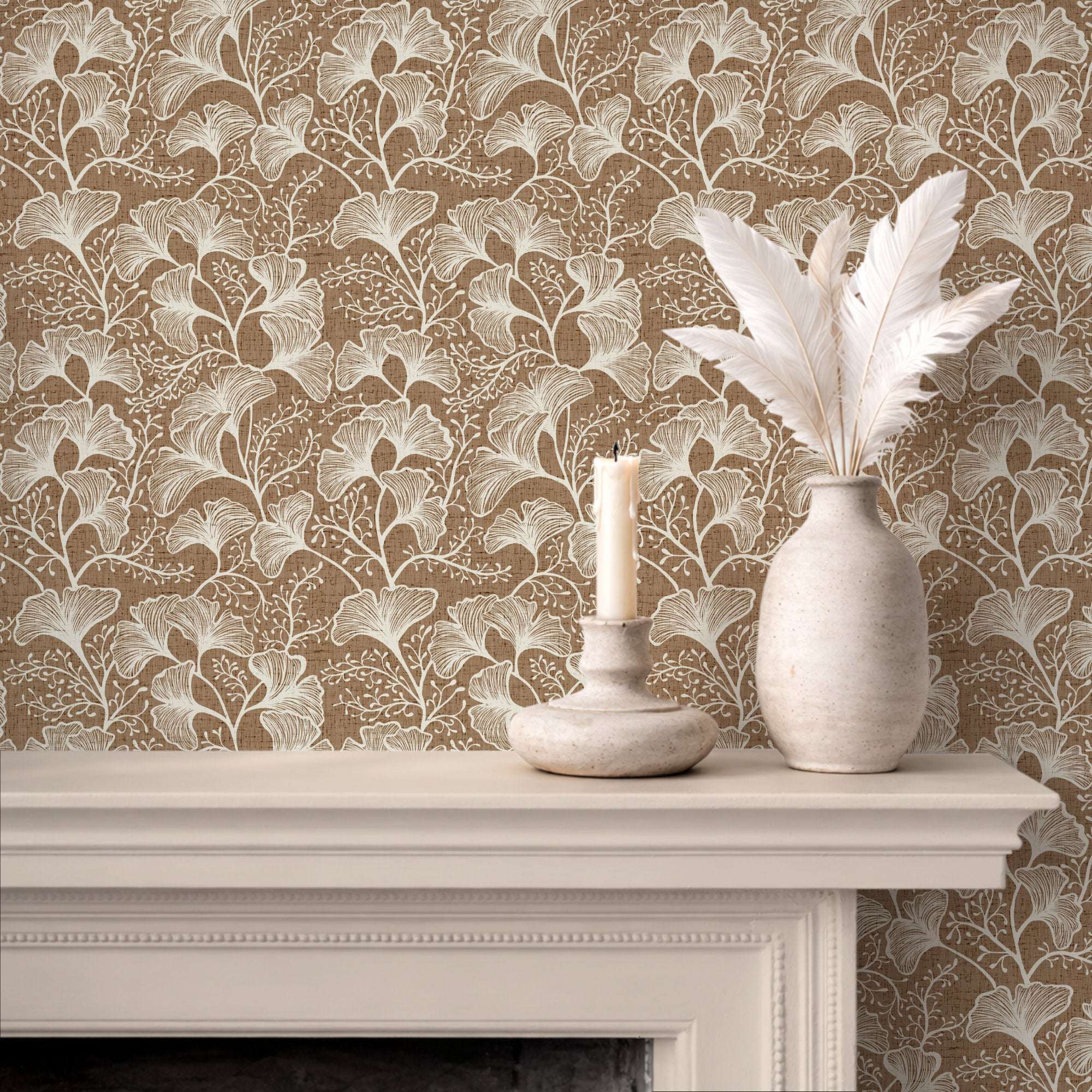 Tan ginkgo leaf wallpaper with cream botanical repeat pattern.