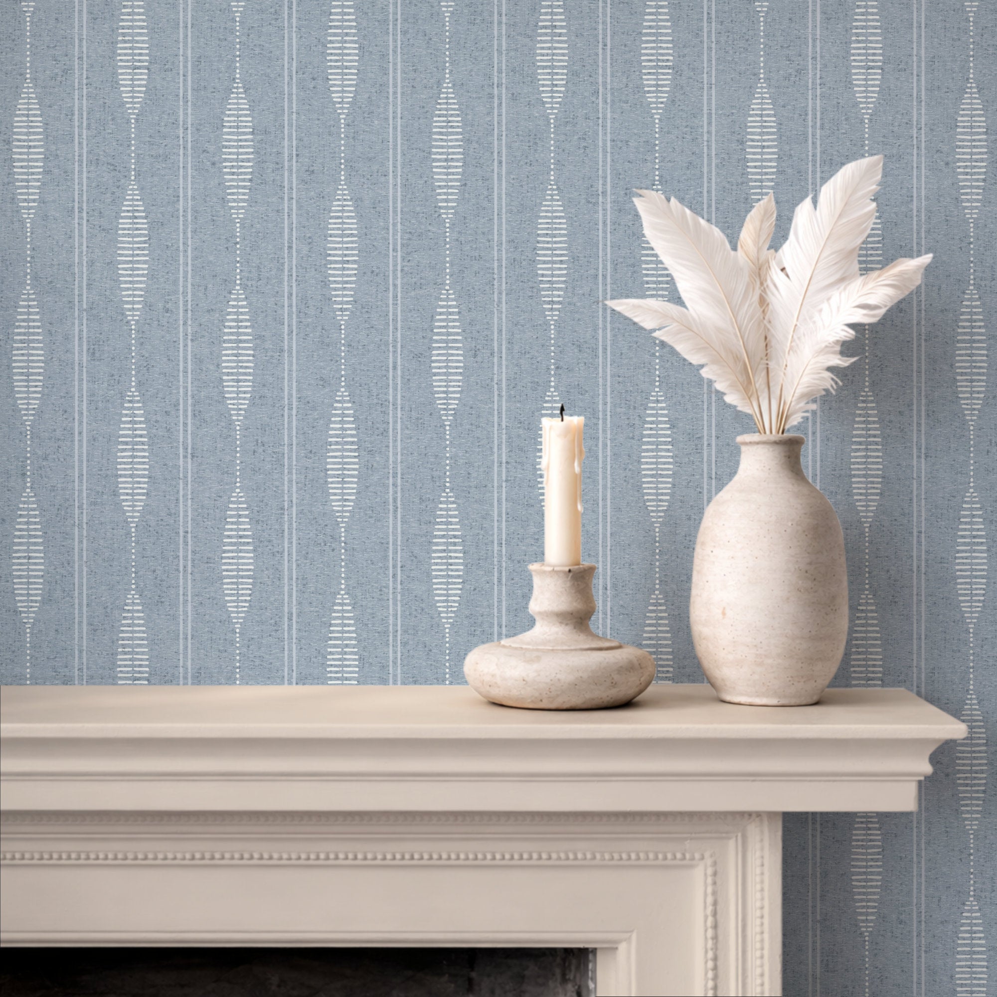 Light blue and white  linen stripe wallpaper behind a fireplace mantel, soft boho stripe