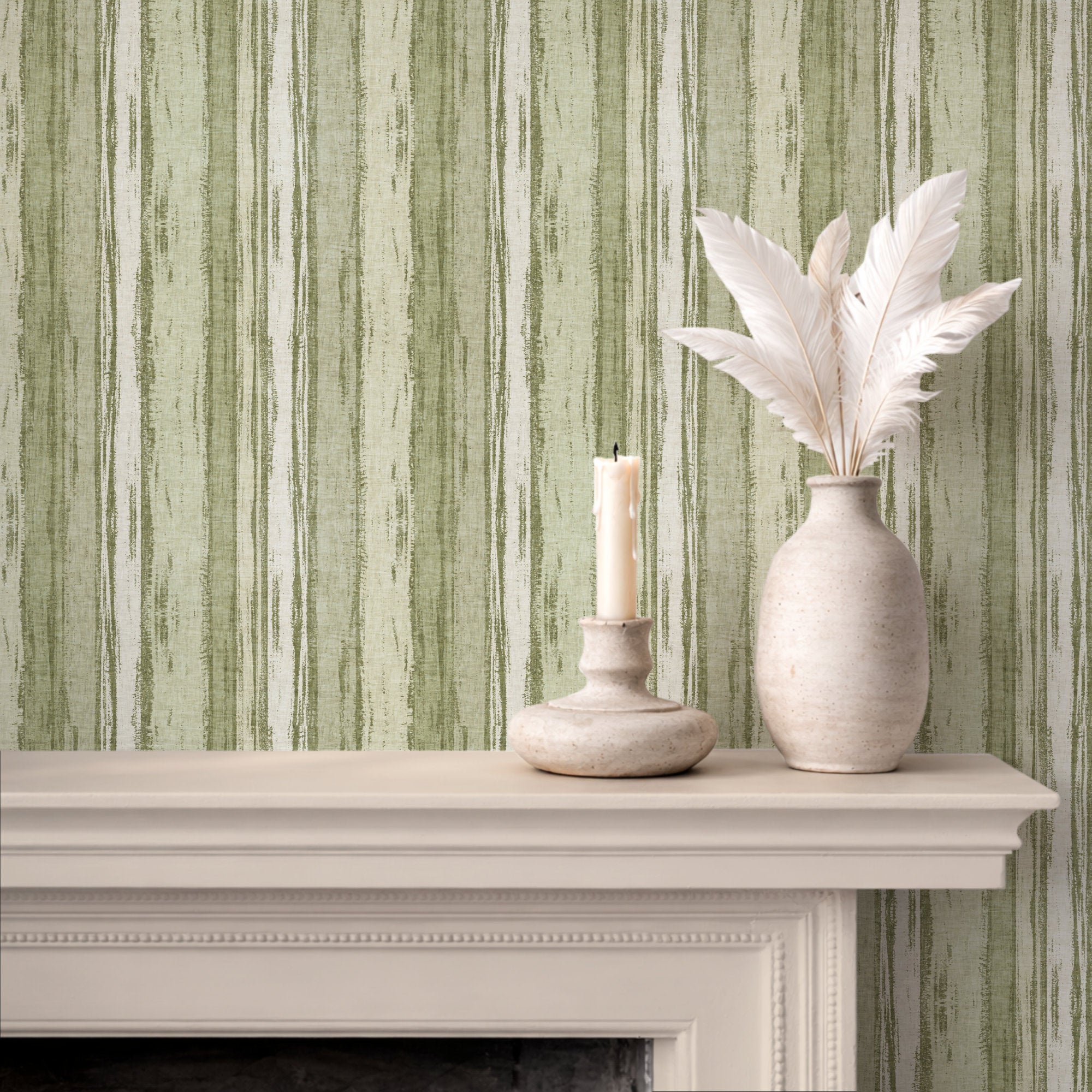 Abstract stripe wallpaper in soft green tones with textured brushstroke design, featuring a candle and vase on a mantel.