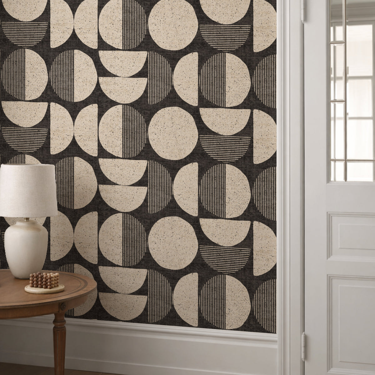 Dark charcoal mid-century modern circle wallpaper in hallway with white panelling