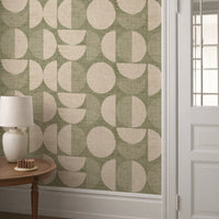 Sage green mid-century modern circle wallpaper in hallway with white panelling