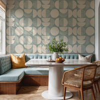 Mid-century modern wallpaper in teal in kitchen diner with banquette seating and parquet floor