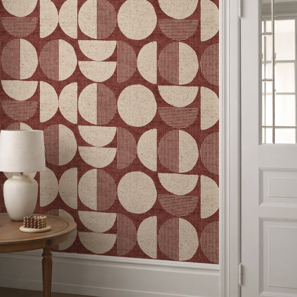 Terracotta mid-century modern circle wallpaper in hallway with white panelling