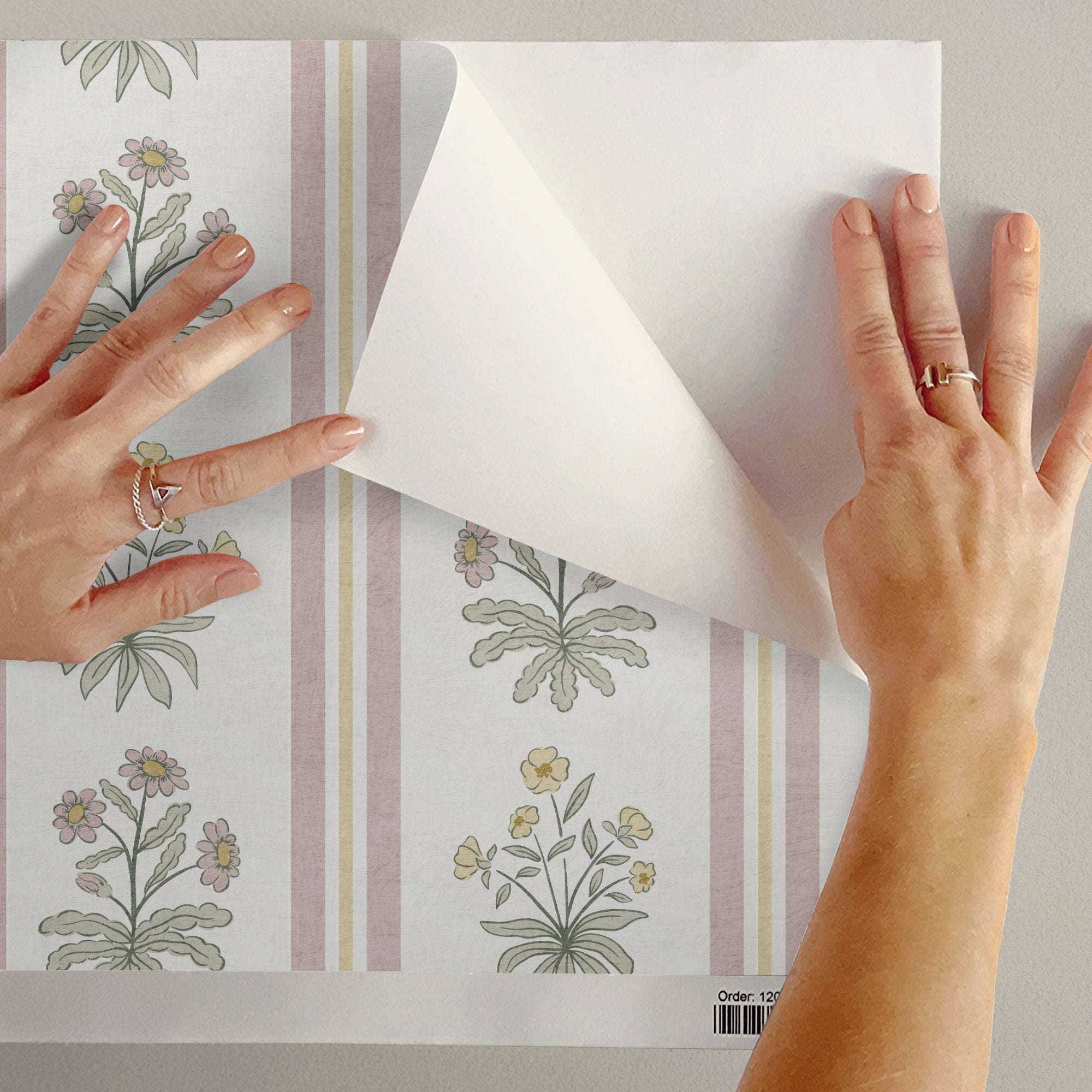 Floral stripe wallpaper sheet with cottage flowers on pale background and vertical pink stripes