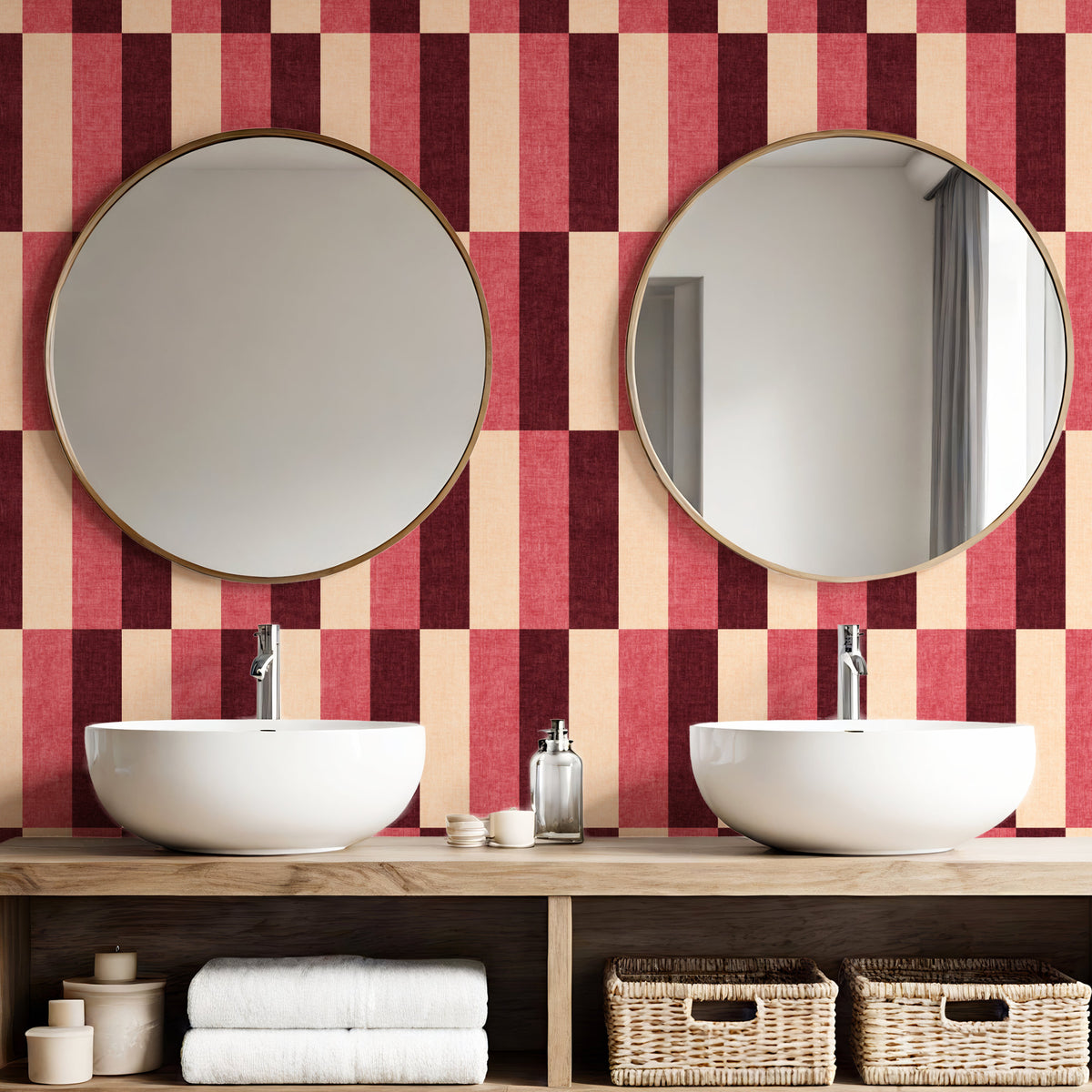 Wide block stripe wallpaper in burgundy and blush pink in bathroom with round mirrors and white basins