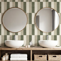 Block stripe wallpaper in sage green and cream in bathroom with round mirrors
