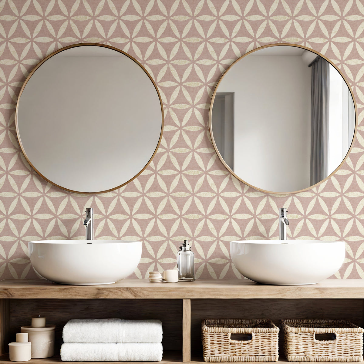 Dusky pink sacred geometric wallpaper in bathroom with double basins and round gold mirrors