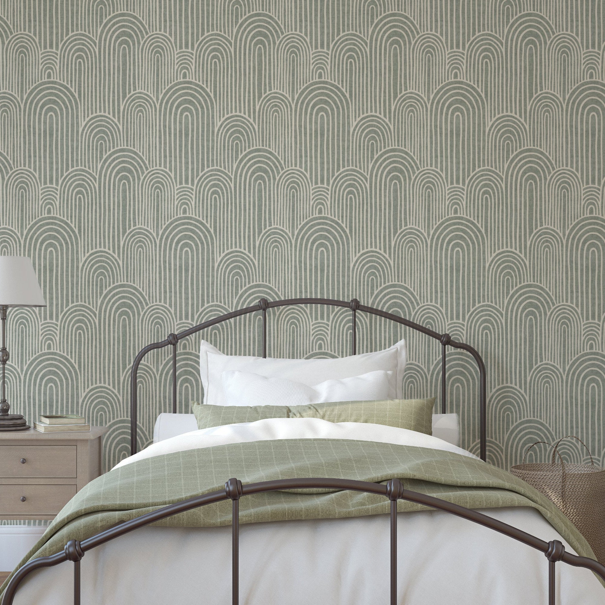 Sage green Scandinavian arches wallpaper behind a metal bed in a modern bedroom with white bedding