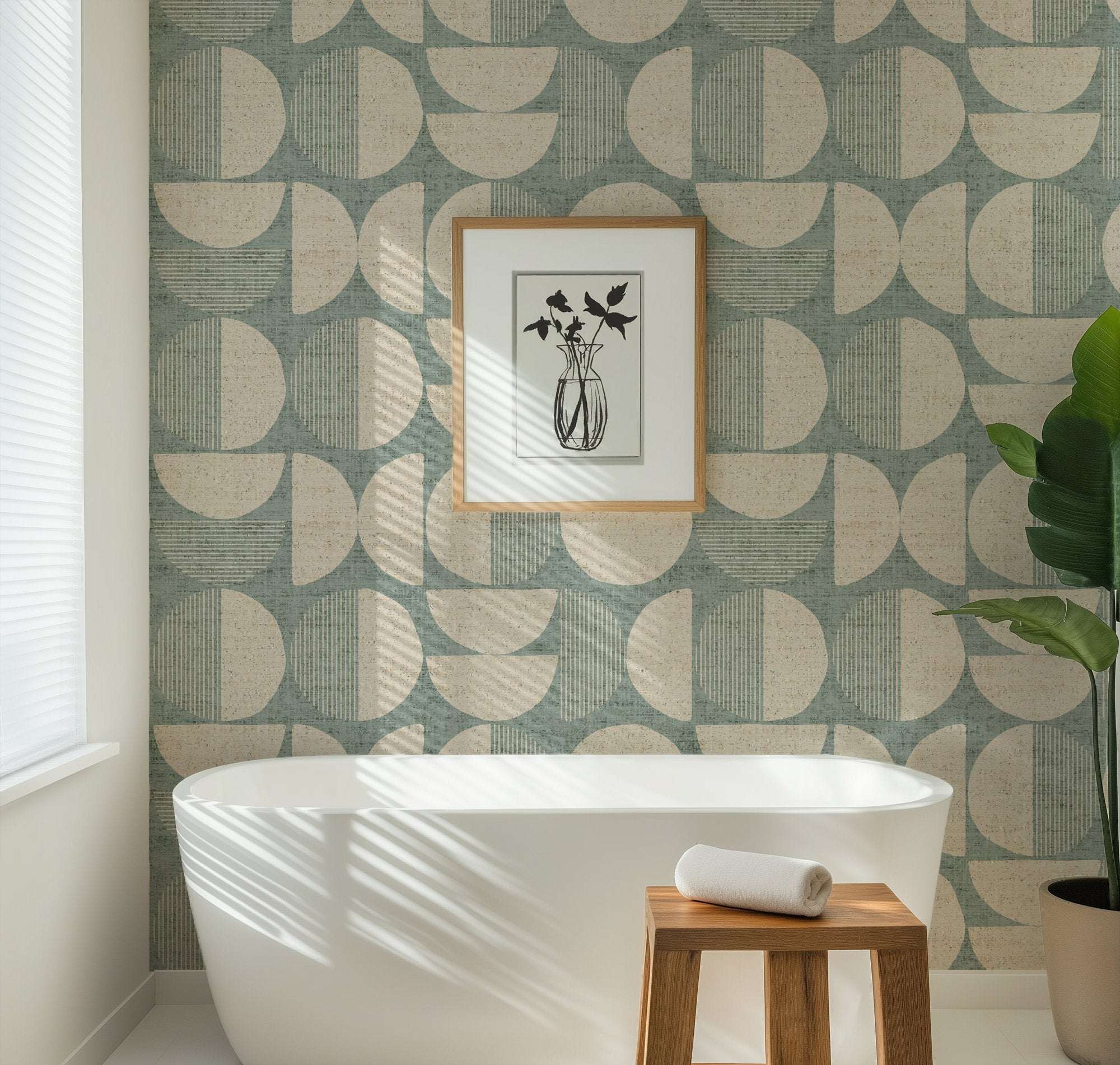 Mid-century circle-pattern wallpaper in teal and beige on wall