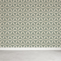 Green geometric wallpaper with classic flower of life circles on a feature wall